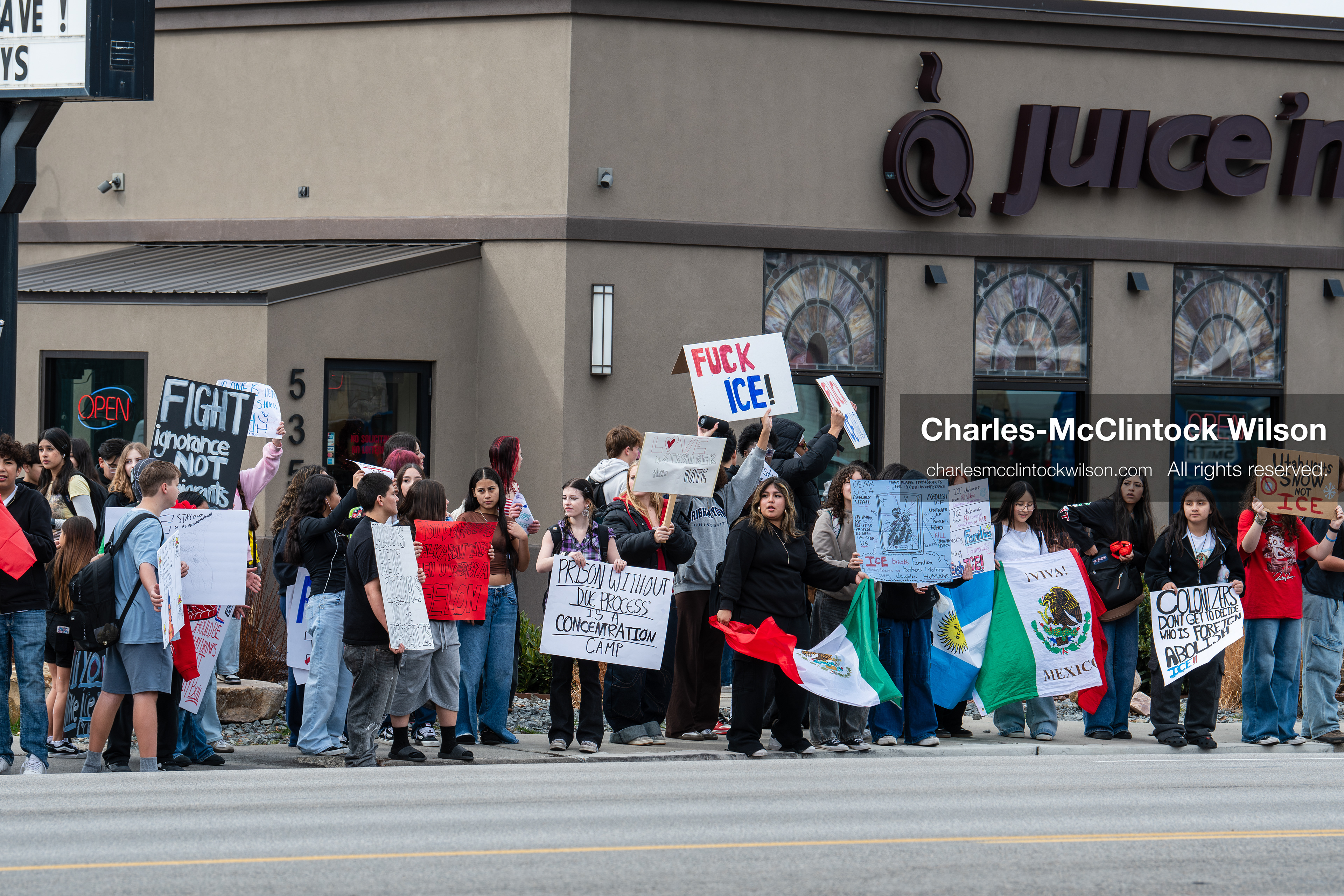 February 11, 2026, Orem, Utah, USA: Students stand on the sidewalk along State Street during a student‑led protest involving participants from multiple Orem schools. (Credit Image: © Charles‑McClintock Wilson/ZUMA Press Wire)