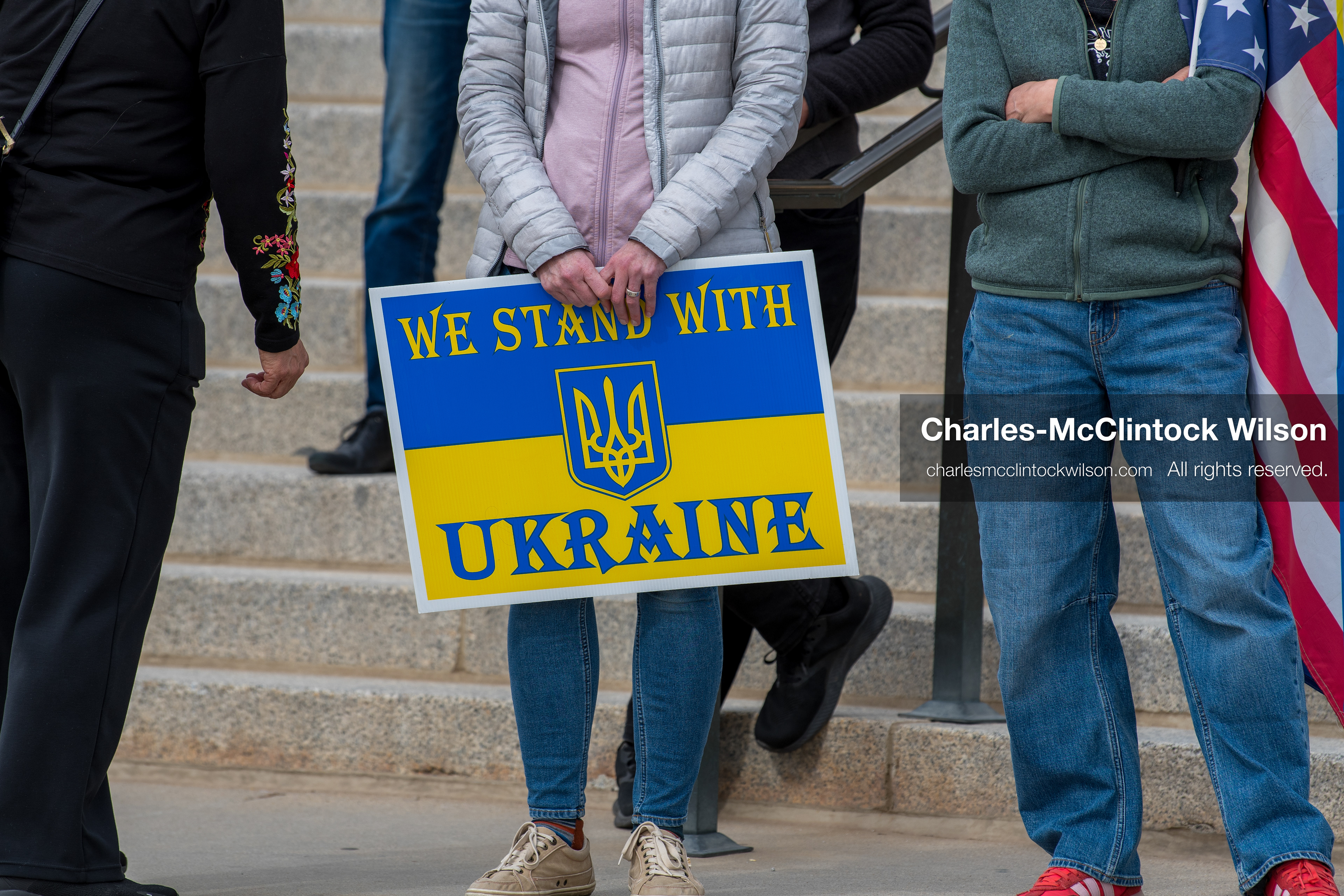 February 28, 2026, Salt Lake City, Utah, USA: A demonstrator holds a sign reading We Stand With Ukraine in the colors of the Ukrainian flag during the Stand With Ukraine rally at the Utah State Capitol. The gathering marked the four year anniversary of the full scale Russian invasion of Ukraine and brought community members together in support of Ukrainians and local humanitarian efforts. (Credit Image: © Charles McClintock Wilson/ZUMA Press Wire)