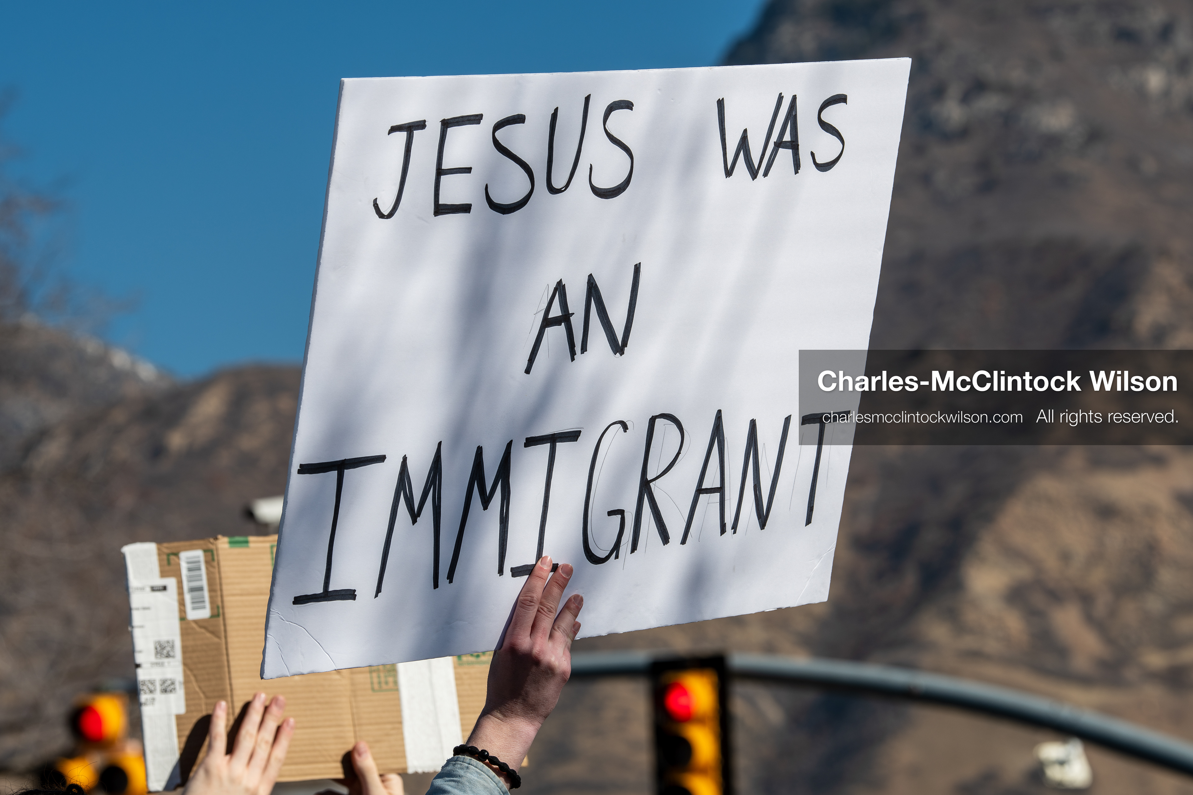 February 5, 2026, Provo, Utah, USA: A demonstrator holds a sign during a gathering near Brigham Young University in Provo where students and community members protested the presence of US Customs and Border Protection recruiters at a career fair held on the BYU campus. (Credit Image: © Charles McClintock Wilson/ZUMA Press Wire)