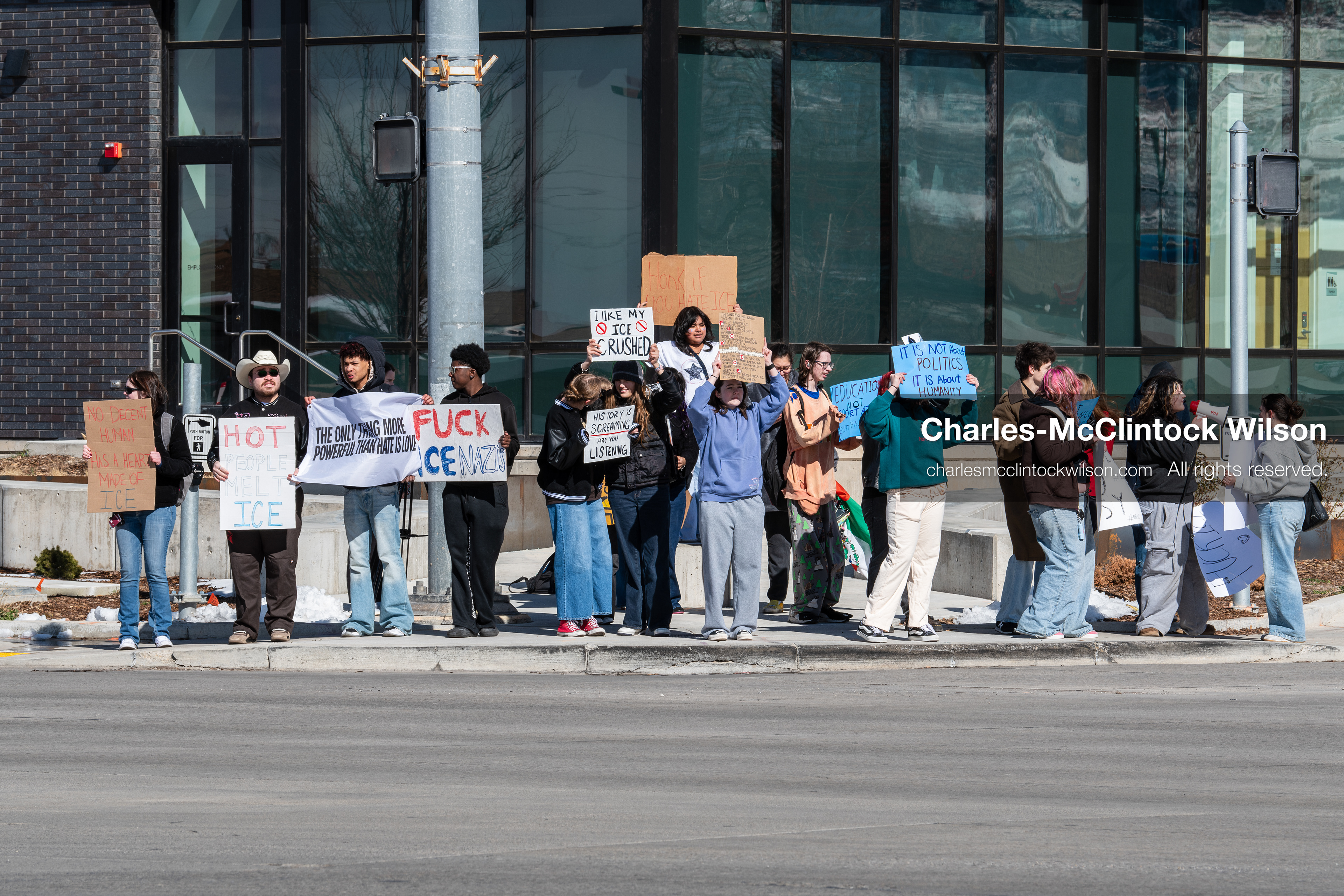 February 20, 2026, Orem, Utah, USA: High school students gather along State Street in front of Orem City Hall during a student led protest against ICE and federal immigration enforcement. Demonstrators hold signs as they stand near the roadway while traffic continues through the area. (Credit Image: © Charles McClintock Wilson/ZUMA Press Wire)