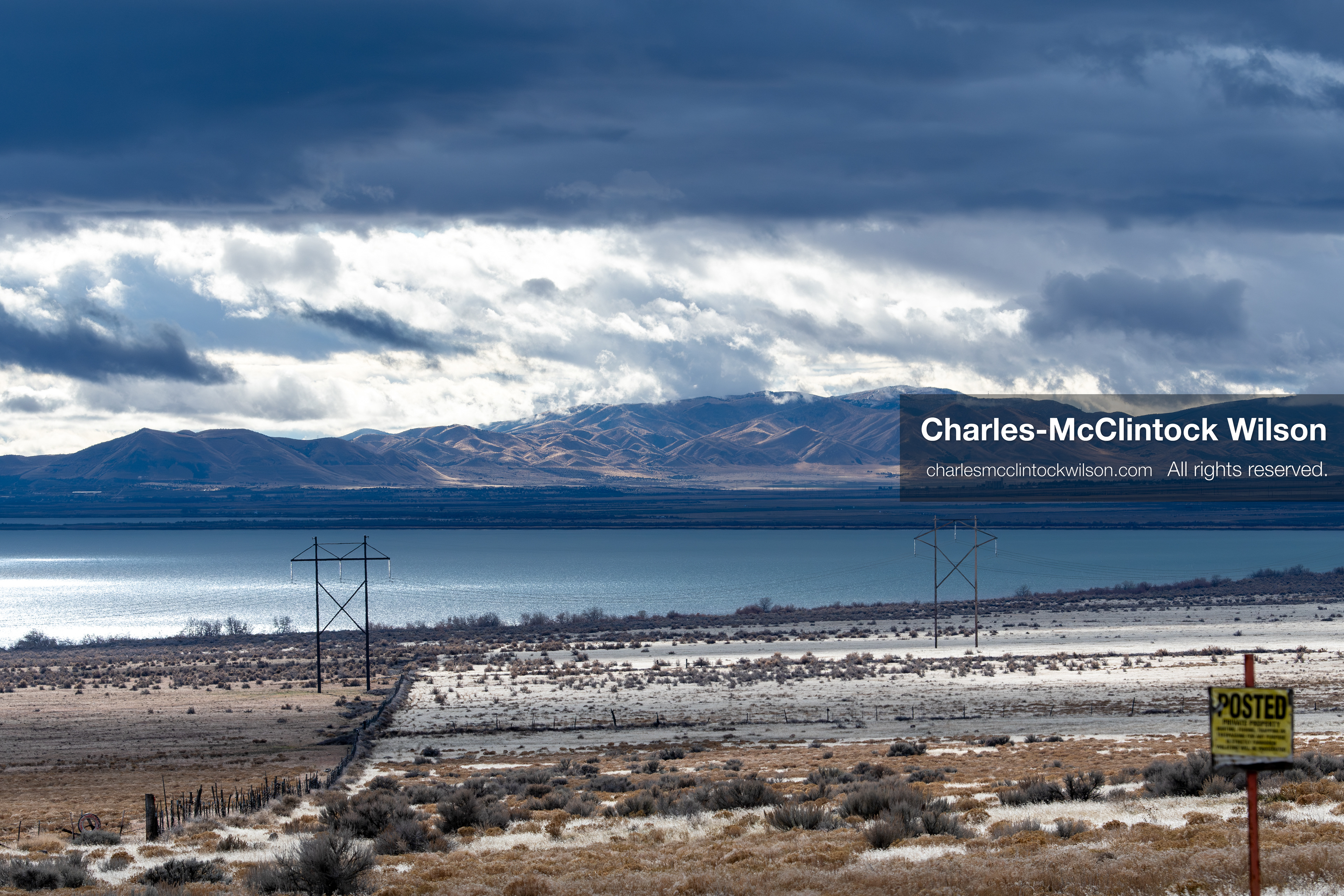January 1, 2026, Saratoga Springs, Utah, USA: Utah Lake is seen under dramatic cloud cover on January 1, 2026, near Saratoga Springs, Utah, USA. Dry grass, power lines, and a posted sign frame the landscape as winter conditions settle across northern Utah. (Credit Image: © Charles-McClintock Wilson/ZUMA Press Wire)