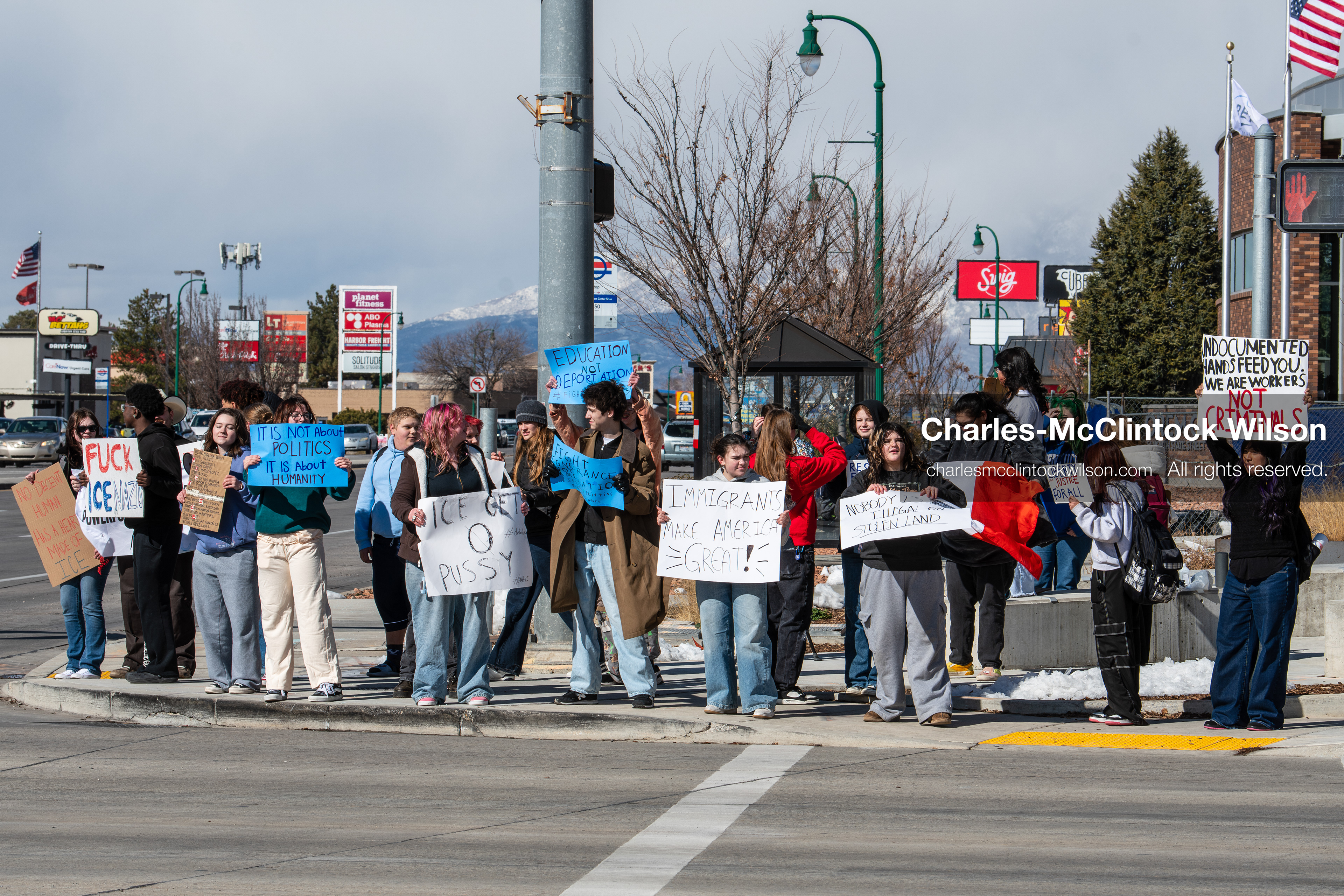 February 20, 2026, Orem, Utah, USA: High school students gather along State Street in front of Orem City Hall during a student led protest against ICE and federal immigration enforcement. Demonstrators hold signs as they stand near the roadway while traffic continues through the area. (Credit Image: © Charles McClintock Wilson/ZUMA Press Wire)