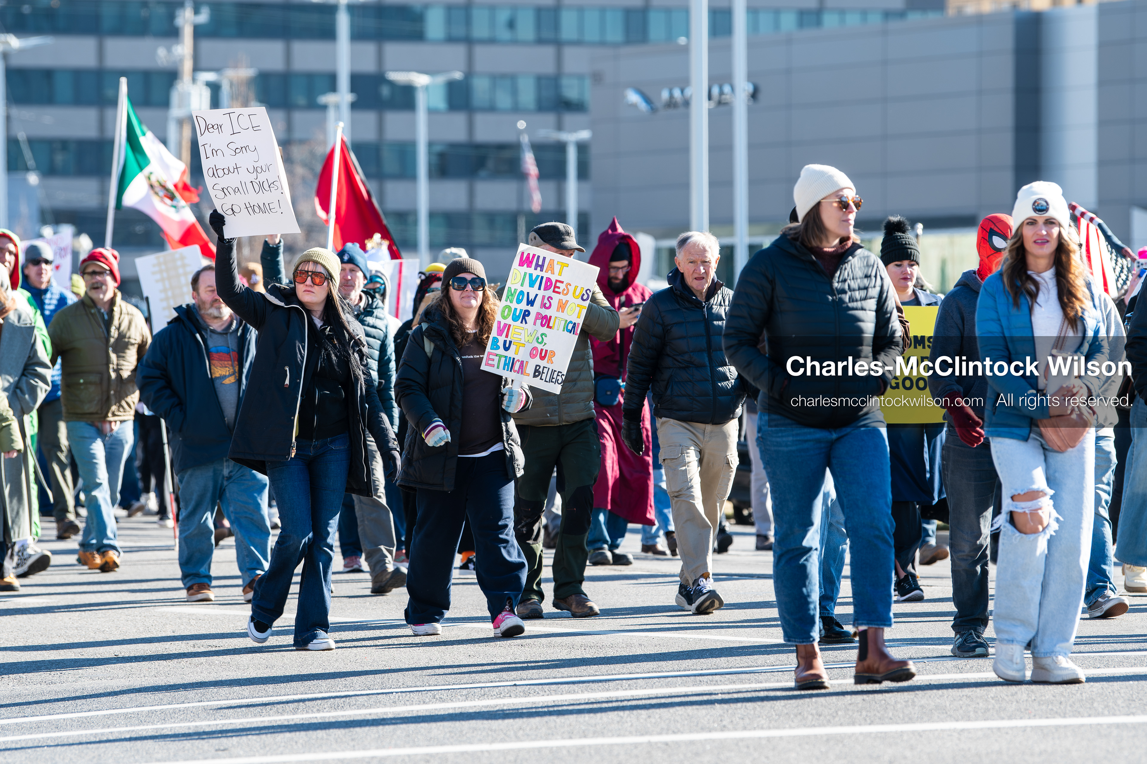 Salt Lake City, Utah, January 10, 2026: A group of demonstrators marches through downtown Salt Lake City during the ICE Out for Good protest, which began at Washington Square Park, with participants carrying signs and personal items as they walk together. (Credit Image: © Charles‑McClintock Wilson/ZUMA Press Wire)