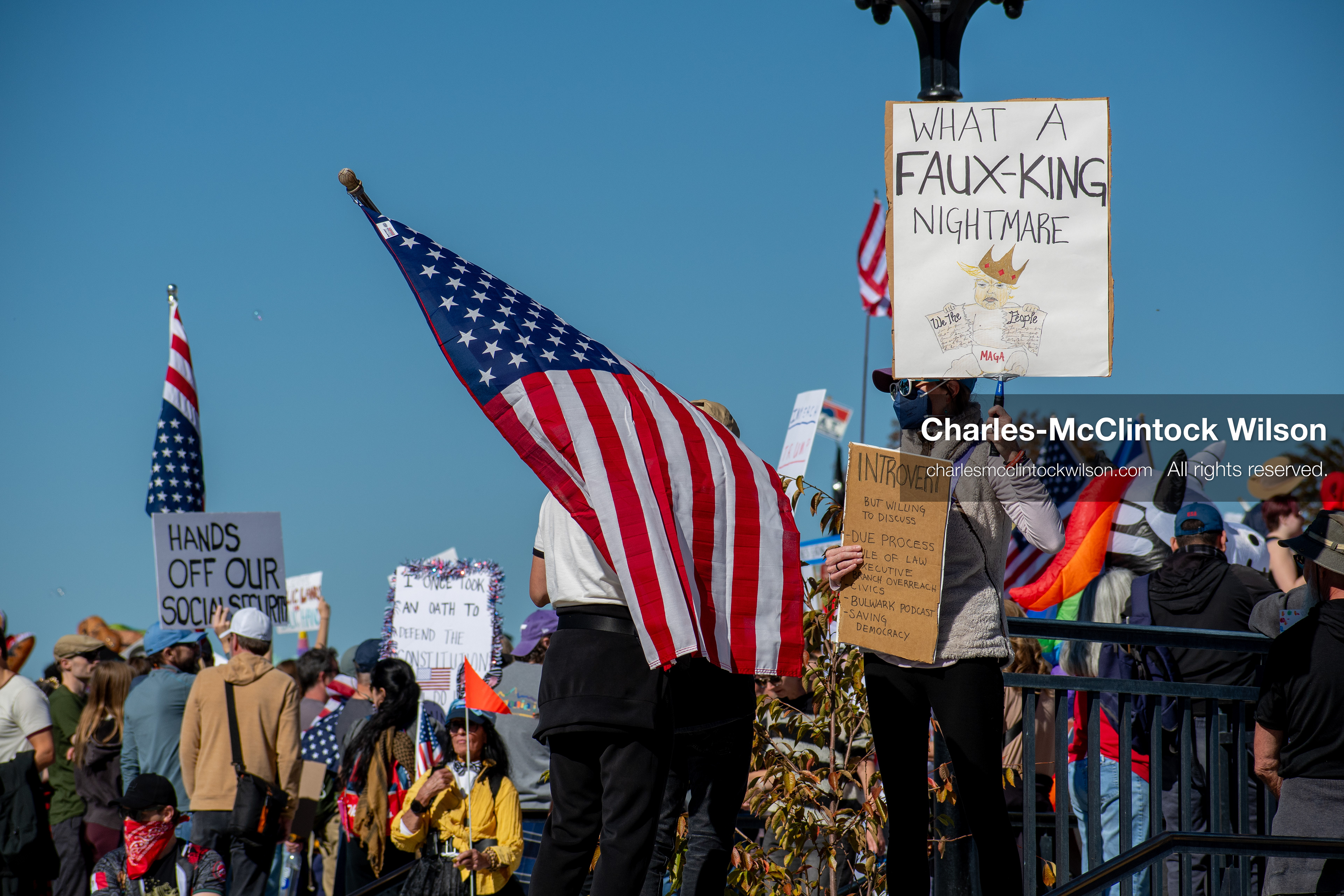 October 18, 2025, Salt Lake City, Utah, USA: Demonstrators hold signs during a "No Kings" protest at the Utah State Capitol. The protest was part of a nationwide mobilization. 