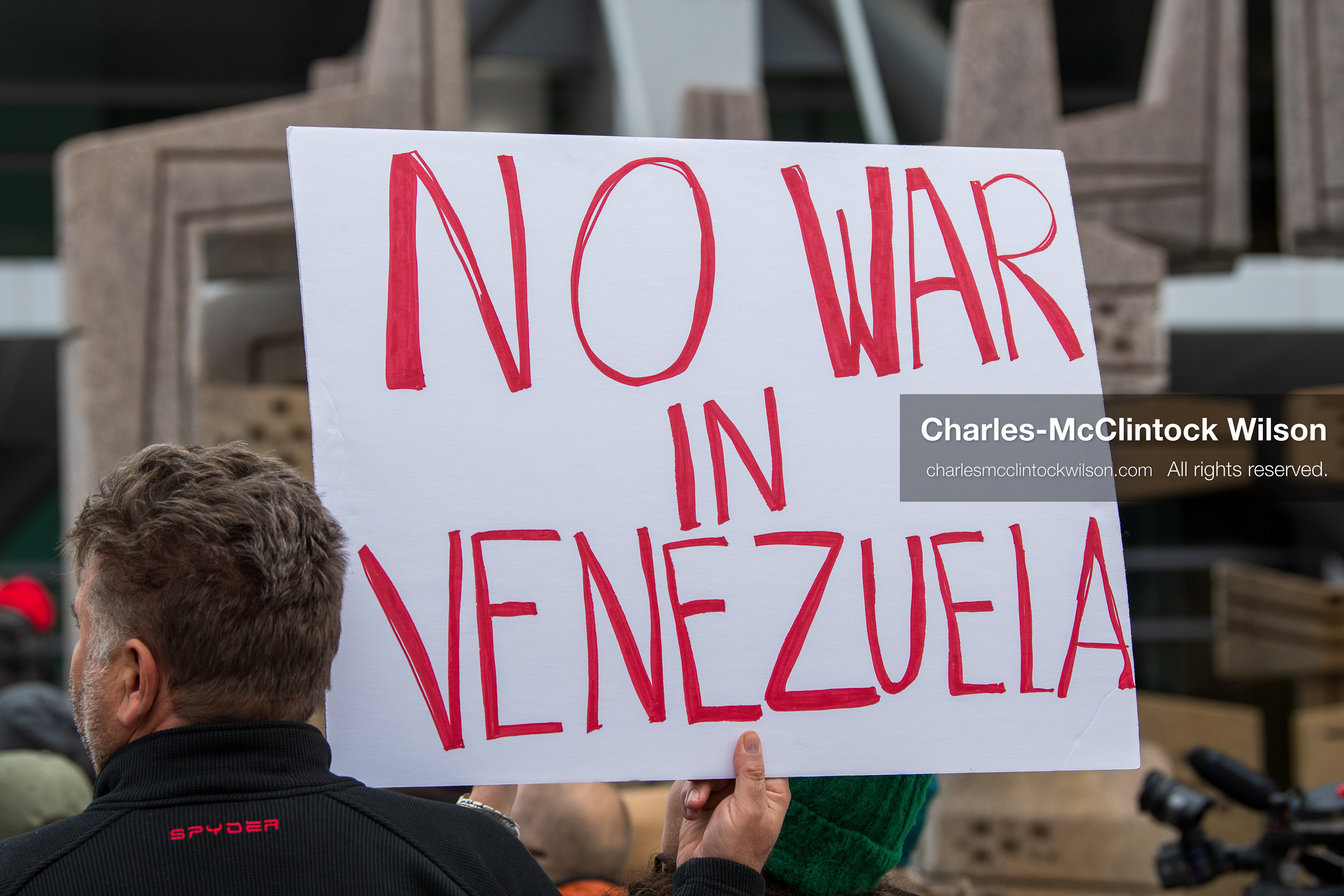 January 3, 2026, Salt Lake City, Utah, USA: A protester holds a sign during a demonstration against US action in Venezuela outside the Wallace Federal Building in Salt Lake City, Utah. The protest was part of a nationwide mobilization responding to recent military developments. (Credit Image: (c) Charles‑McClintock Wilson/ZUMA Press Wire)