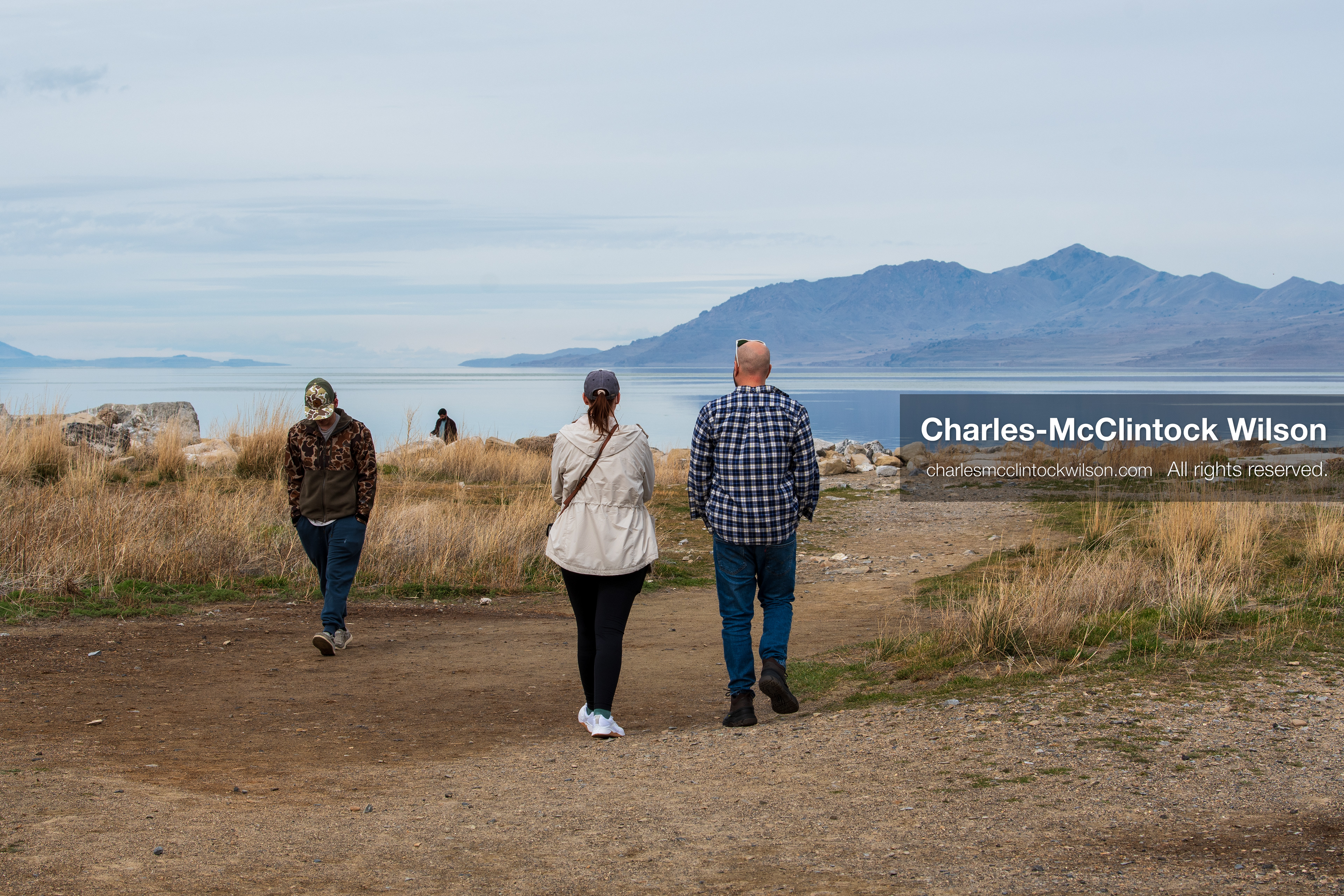 March 1, 2026, Great Salt Lake, Utah, USA: People walk along a narrow stretch of shoreline at the Great Salt Lake as water levels remain historically low. Reports from state officials and the Great Salt Lake Strike Team state that the lake continues to fall within a serious adverse‑effects range, with elevations among the lowest recorded in more than one hundred years. The lake has drawn increased public attention as lawmakers consider large‑scale water projects and long‑term plans to address declining conditions. (Credit Image: © Charles‑McClintock Wilson/ZUMA Press Wire)