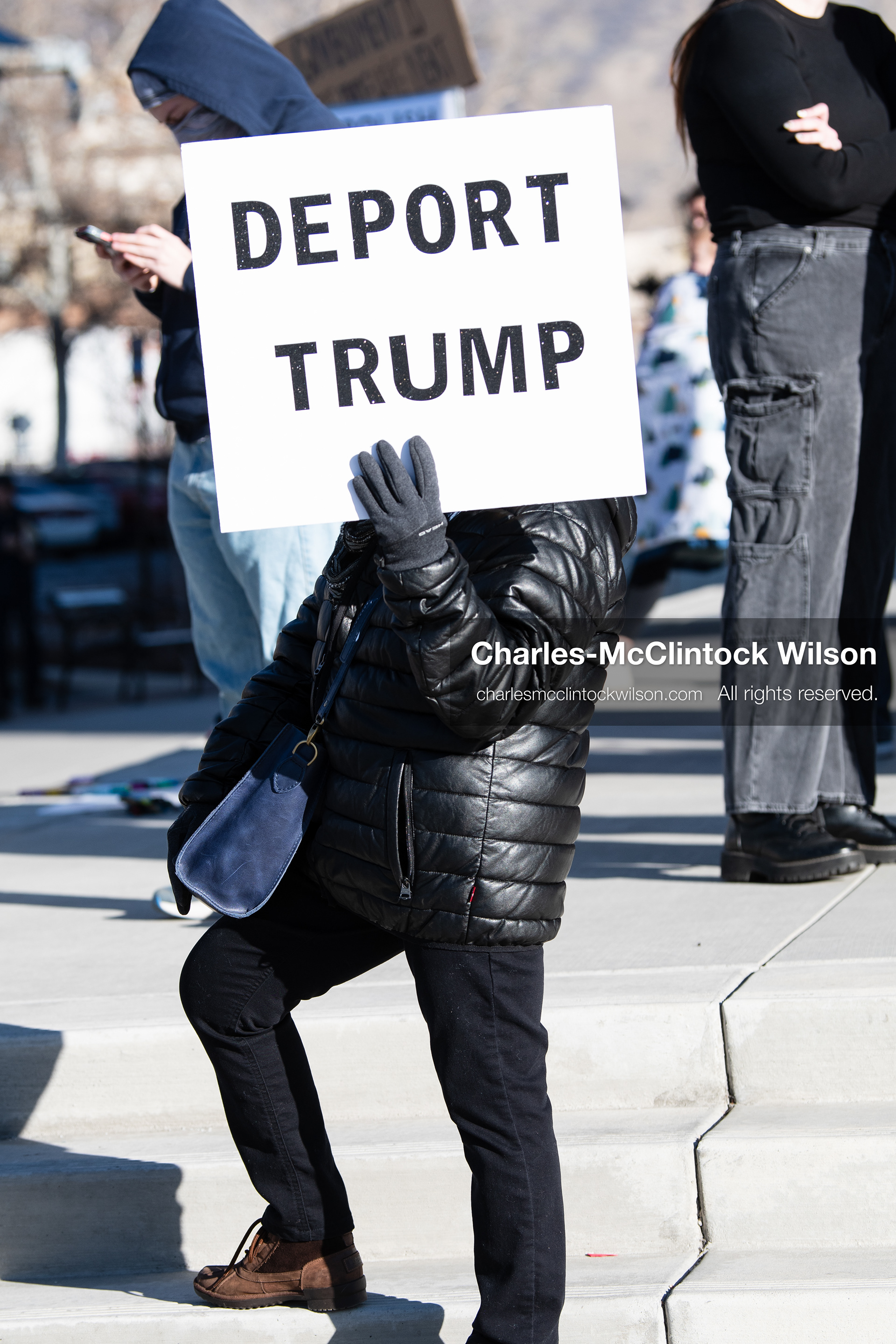  January 20, 2026, Provo, Utah, USA: A demonstrator stands outside Provo City Hall during the Free America Walkout protest in Provo Utah on January 20 2026. The nationwide event called for immigration reform and changes to detention practices.