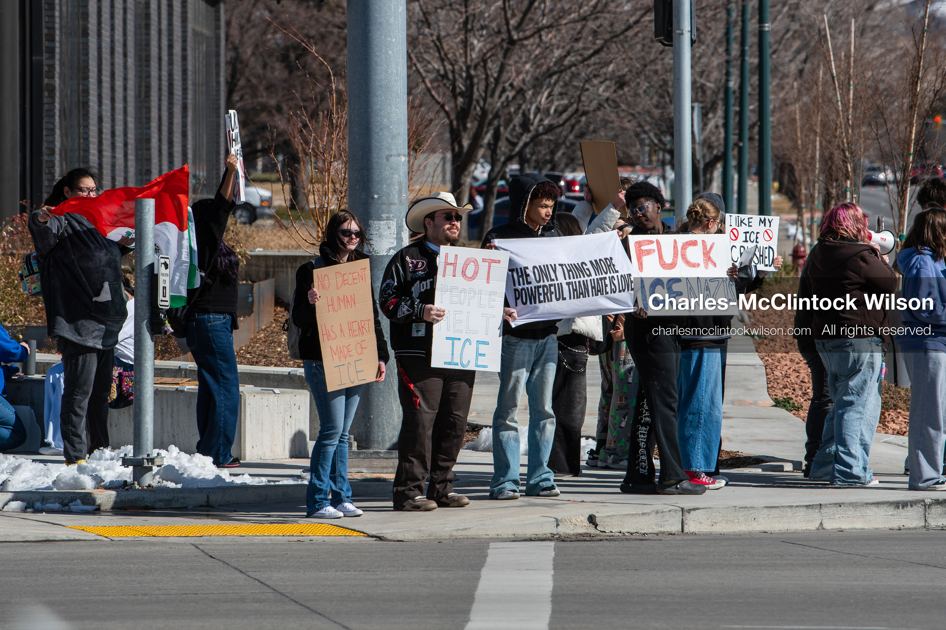 February 20, 2026, Orem, Utah, USA: High school students gather along State Street in front of Orem City Hall during a student led protest against ICE and federal immigration enforcement. Demonstrators hold signs as they stand near the roadway while traffic continues through the area. (Credit Image: © Charles McClintock Wilson/ZUMA Press Wire)