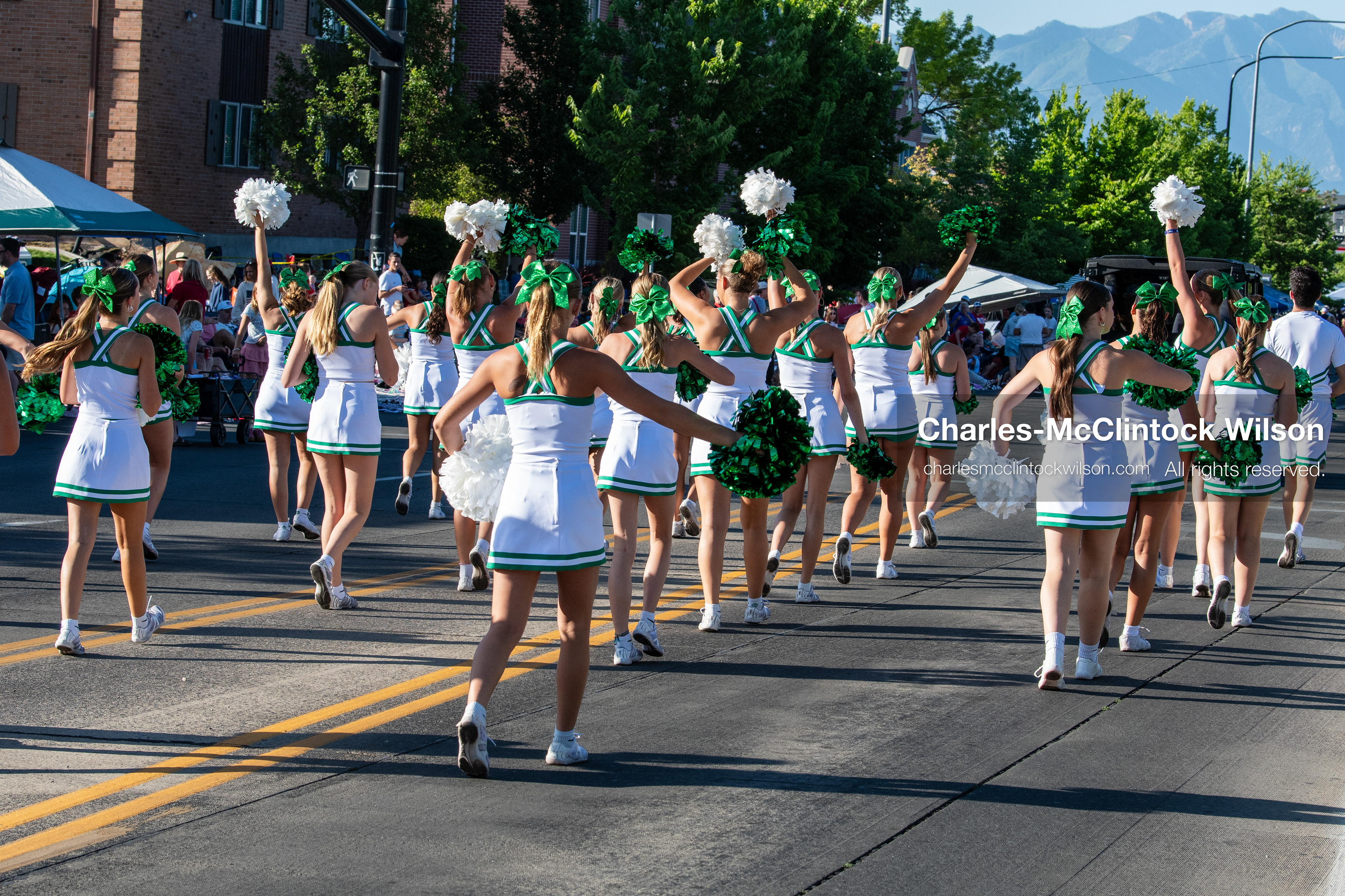 July 4, 2026, Provo, Utah, USA: Cheerleaders holding green and white pom-poms march down the street during America's Freedom Festival Grand Parade in Provo, Utah, Saturday, July 4, 2026. The annual Independence Day event features expanded programming to honor the 250th anniversary of United States independence. (Credit Image: © Charles-McClintock Wilson/ZUMA Press Wire)