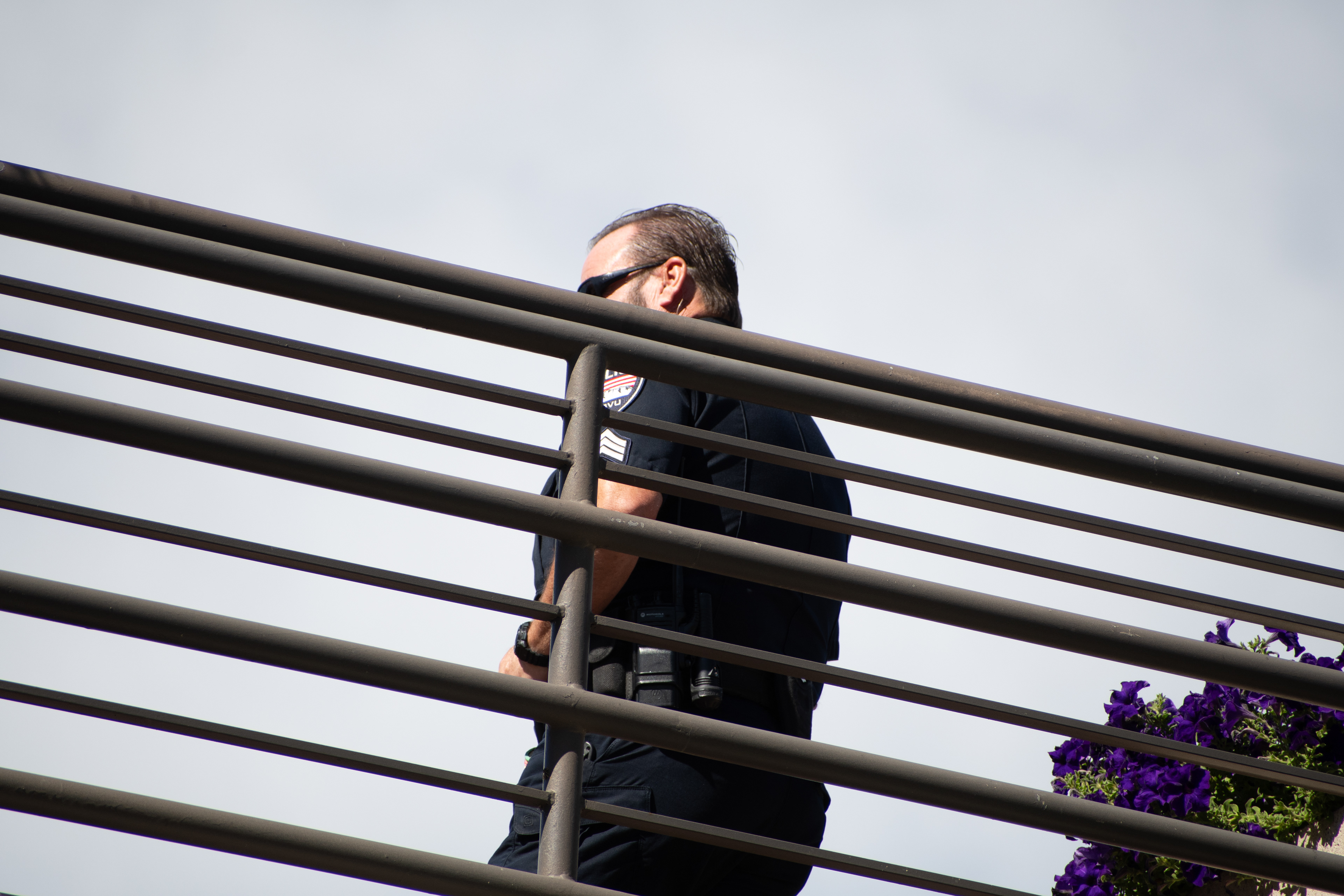 September 10, 2025 – Orem, Utah, United States: A Utah Valley University police officer maintains a security post on an elevated walkway ahead of a scheduled public event featuring conservative activist Charlie Kirk. Photograph by Charles‑McClintock Wilson / ZUMA Press Wire