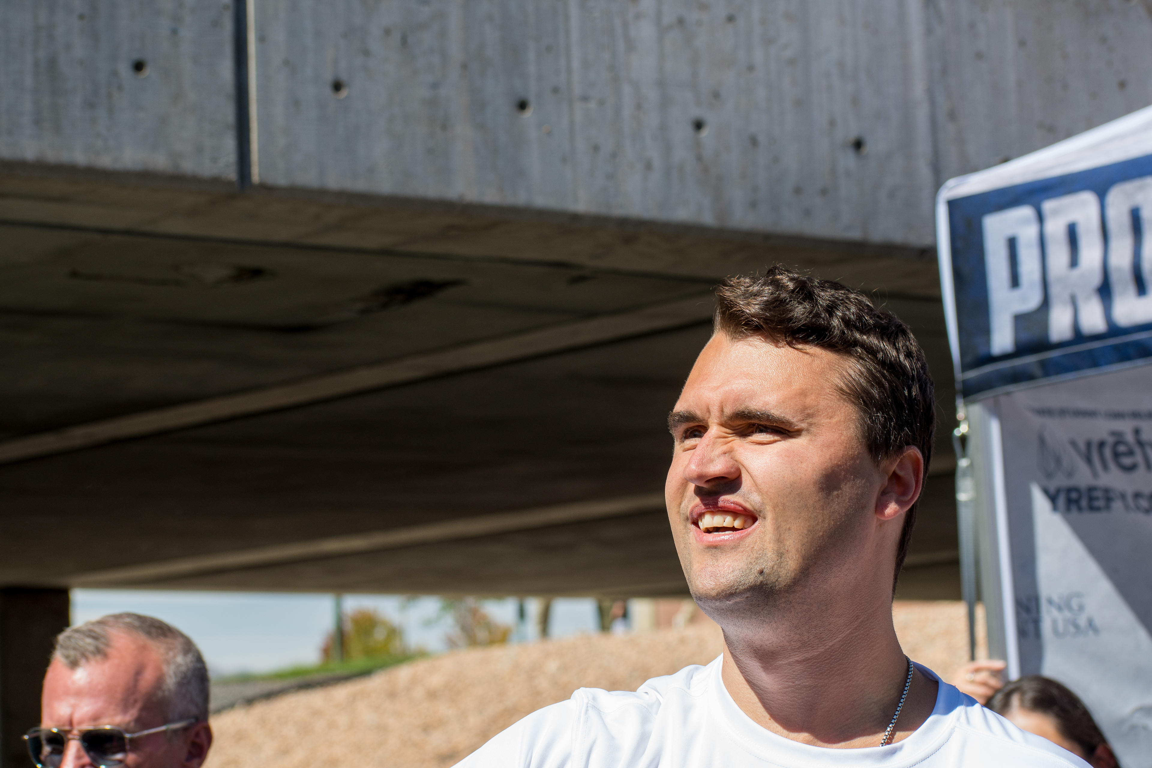 OREM, UTAH – SEPTEMBER 10, 2025: Charlie Kirk speaks with attendees during a public event at Utah Valley University. Positioned near a promotional booth and surrounded by supporters, Kirk appears engaged and expressive in one of his final public moments. The image reflects the atmosphere of direct outreach and energized dialogue that defined the gathering. © Charles-McClintock Wilson / ZUMA Press