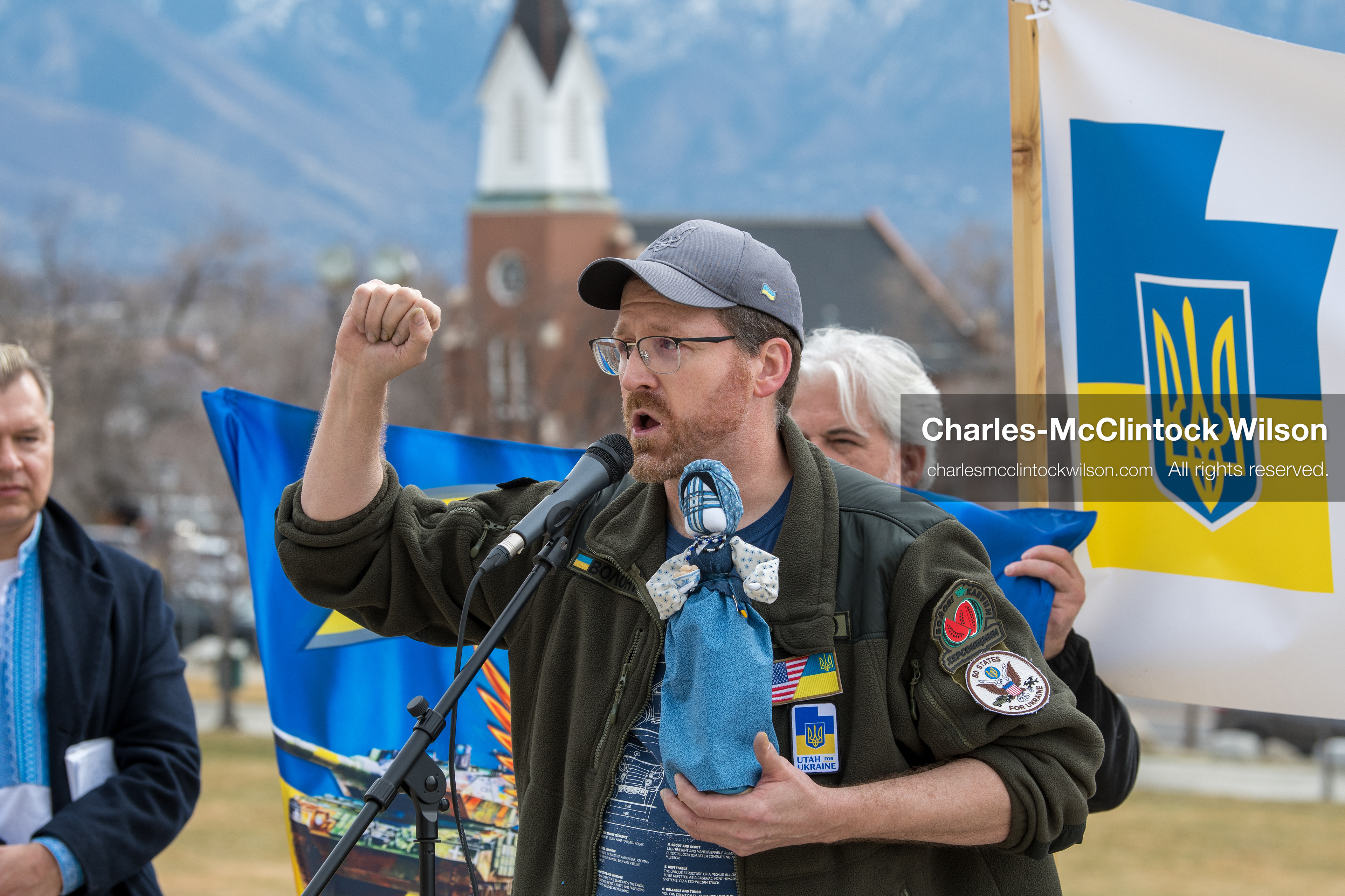 February 28, 2026, Salt Lake City, Utah, USA: NATHANIEL SANDERS, a Salt Lake County Deputy District Attorney and a vocal advocate for Ukraine, speaks while holding a traditional Ukrainian motanka doll, a handmade protective symbol, during the Stand With Ukraine rally at the Utah State Capitol. The event marked the four year anniversary of the full scale Russian invasion of Ukraine and brought community members together in support of Ukrainians and local humanitarian efforts. (Credit Image: © Charles McClintock Wilson/ZUMA Press Wire)