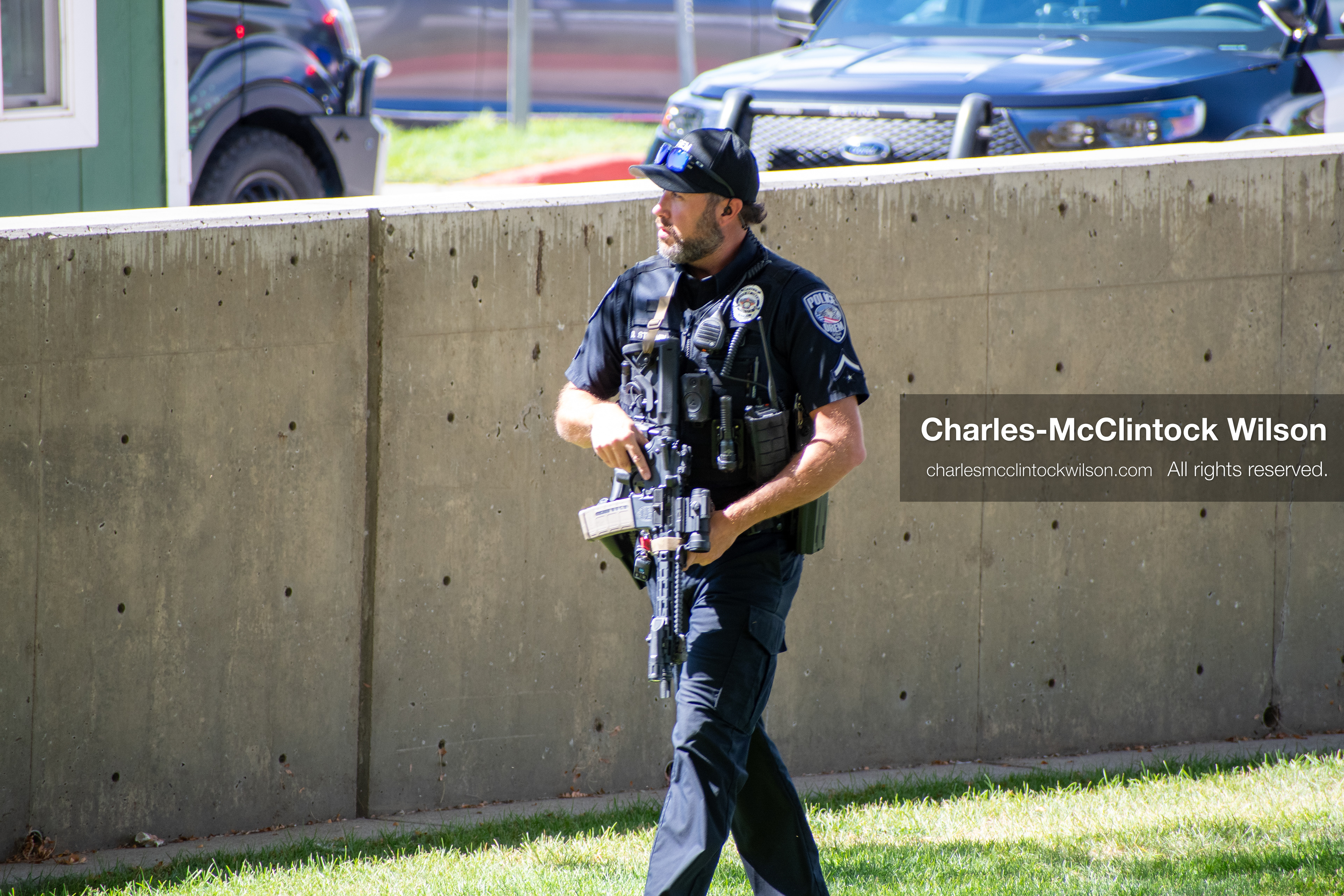 September 10, 2025, Orem, Utah, USA: A law enforcement officer patrols the perimeter near Utah Valley University following the fatal shooting of conservative activist Charlie Kirk during a campus event. The officer carries a rifle and remains alert as emergency protocols unfold. The incident prompted a full campus evacuation and a multi-agency response. (Credit Image: © Charles-McClintock Wilson/ZUMA Press Wire)
