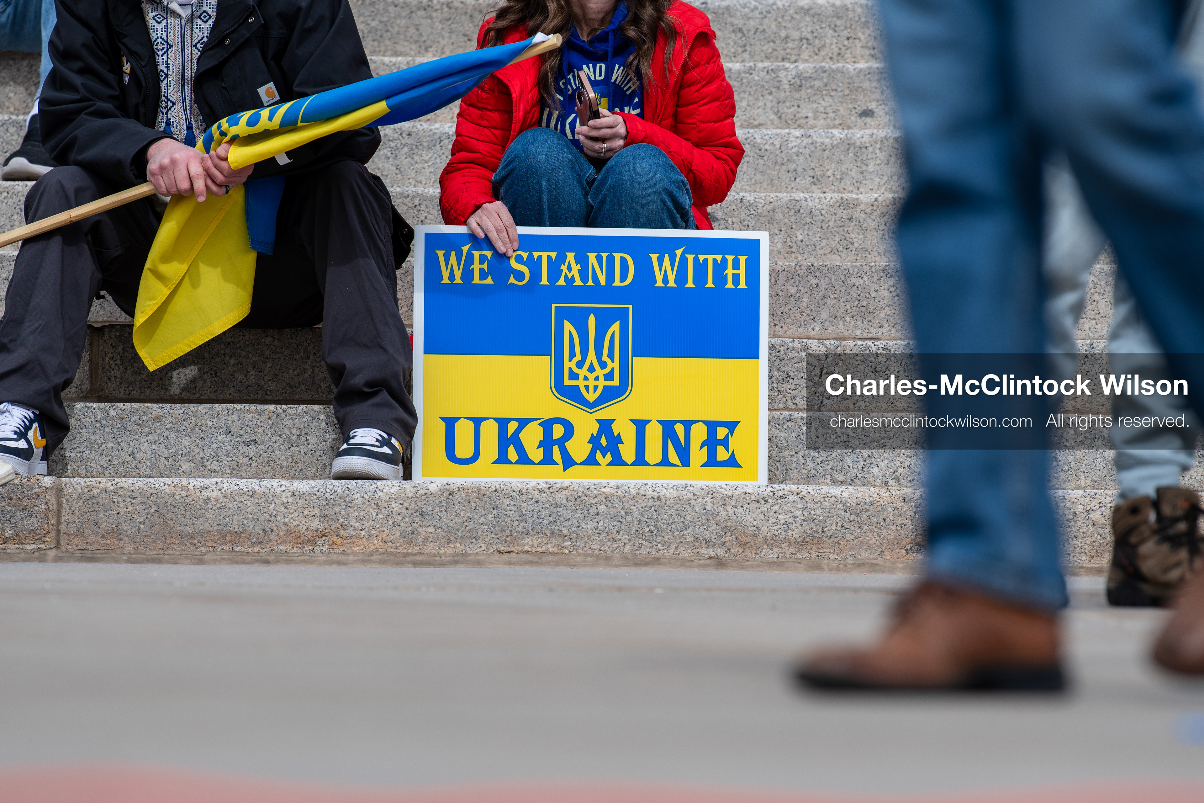 February 28, 2026, Salt Lake City, Utah, USA: A demonstrator holds a sign reading We Stand With Ukraine in the colors of the Ukrainian flag during the Stand With Ukraine rally at the Utah State Capitol. The gathering marked the four year anniversary of the full scale Russian invasion of Ukraine and brought community members together in support of Ukrainians and local humanitarian efforts. (Credit Image: © Charles McClintock Wilson/ZUMA Press Wire)