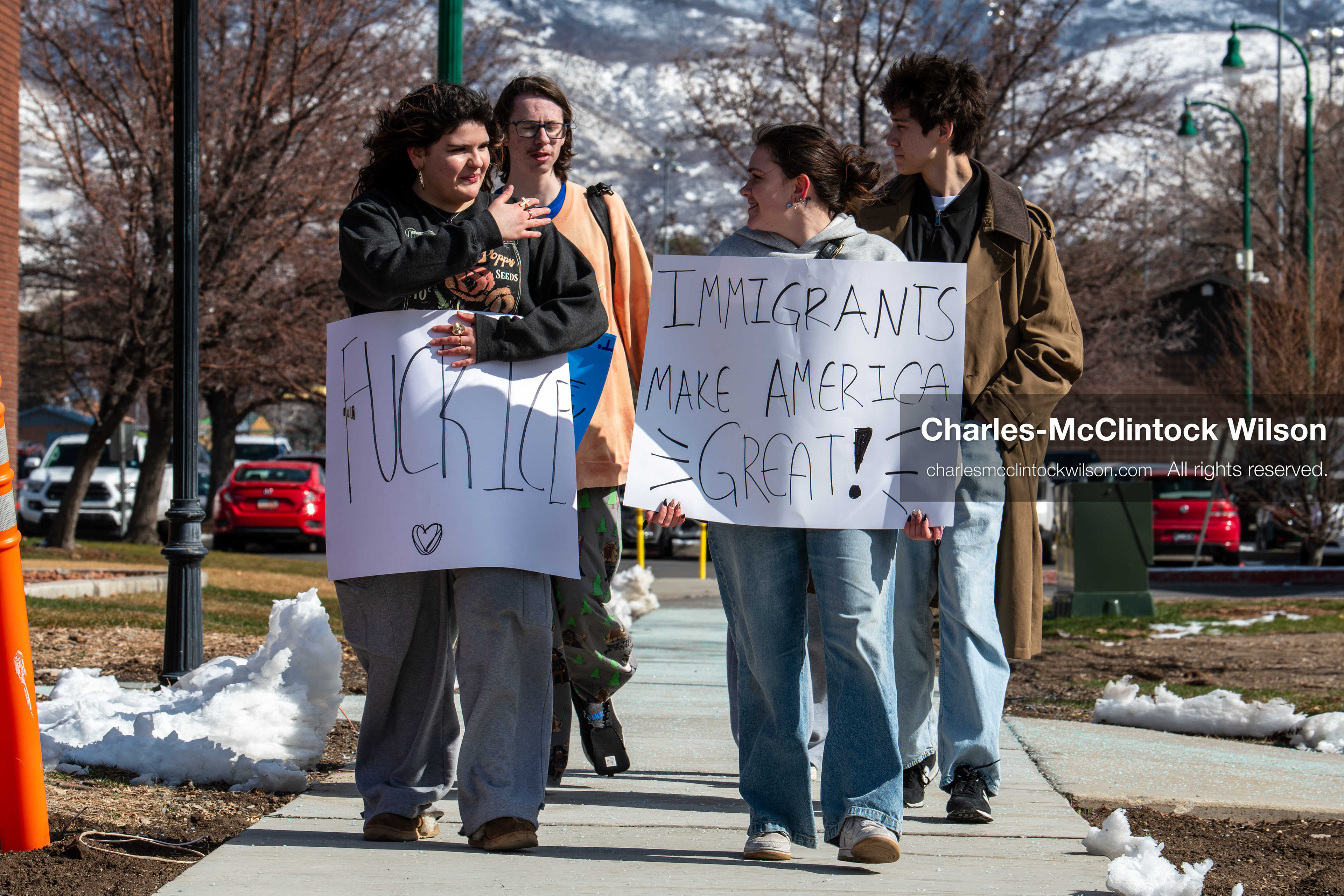 February 20, 2026, Orem, Utah, USA: Participants walk together during a student led protest against ICE in front of Orem City Hall. Some carry signs as the group moves along State Street during the event. (Credit Image: © Charles McClintock Wilson/ZUMA Press Wire)