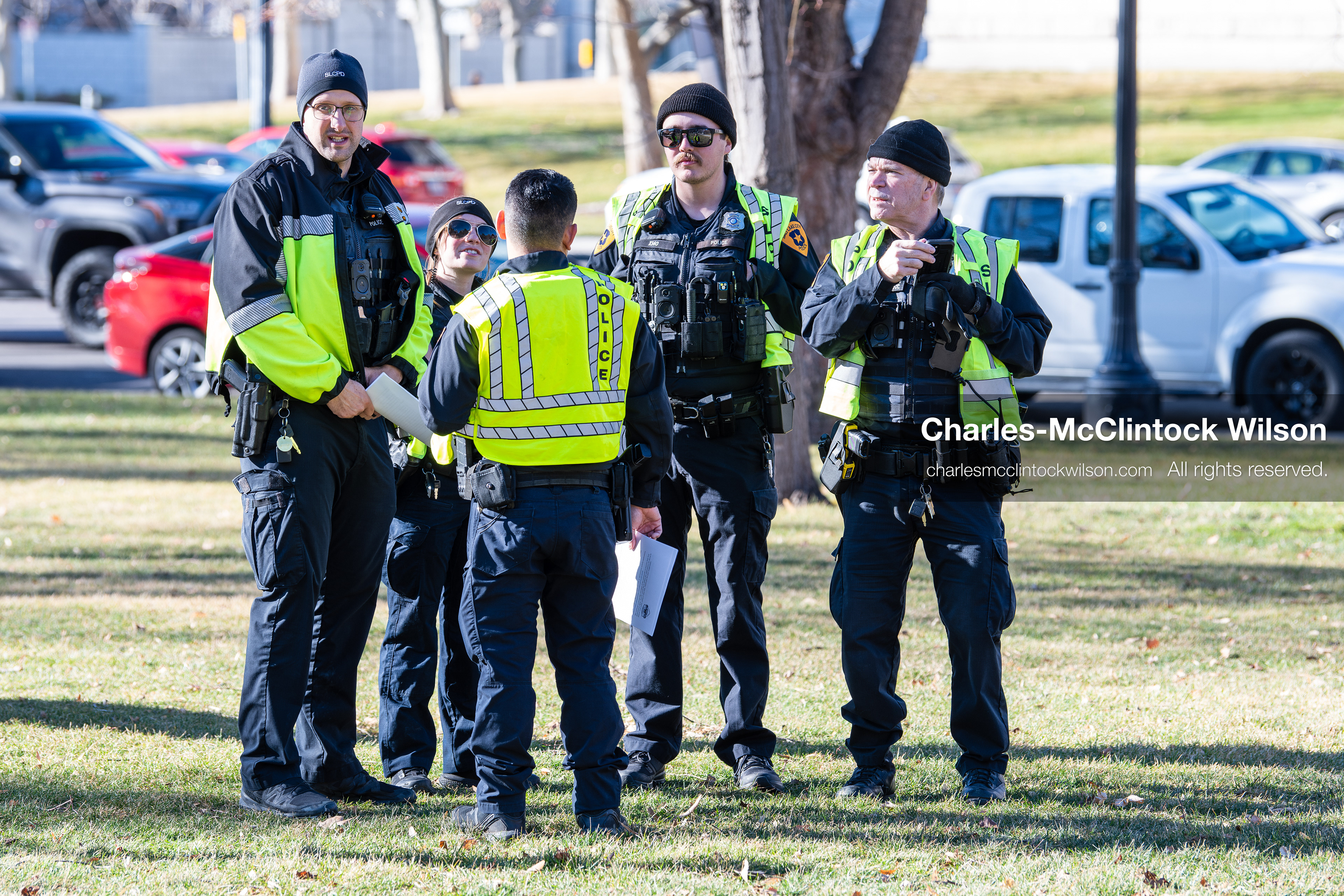Salt Lake City, Utah, January 10, 2026: Salt Lake City Police Department officers gather on the lawn near Washington Square Park during the ICE Out for Good protest, a demonstration calling for justice for Renee Nicole Good. Officers wore cold‑weather gear and high‑visibility vests. (Credit Image: © Charles‑McClintock Wilson/ZUMA Press Wire)