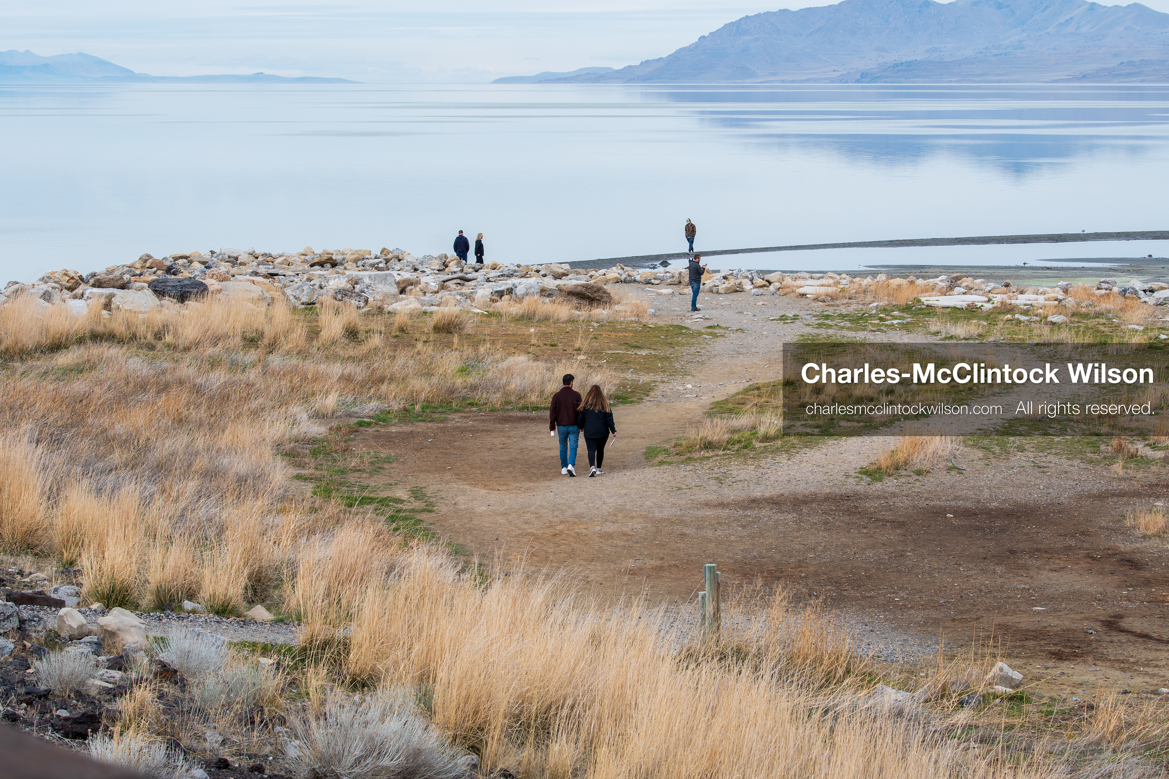 March 1, 2026, Great Salt Lake, Utah, USA: People walk along the shoreline of the Great Salt Lake as water levels remain historically low. Reports from state officials and the Great Salt Lake Strike Team state that the lake continues to fall within a serious adverse‑effects range, with elevations among the lowest recorded in more than one hundred years. The lake has drawn increased public attention as lawmakers consider large‑scale water projects and long‑term plans to address declining conditions. (Credit Image: © Charles‑McClintock Wilson/ZUMA Press Wire)