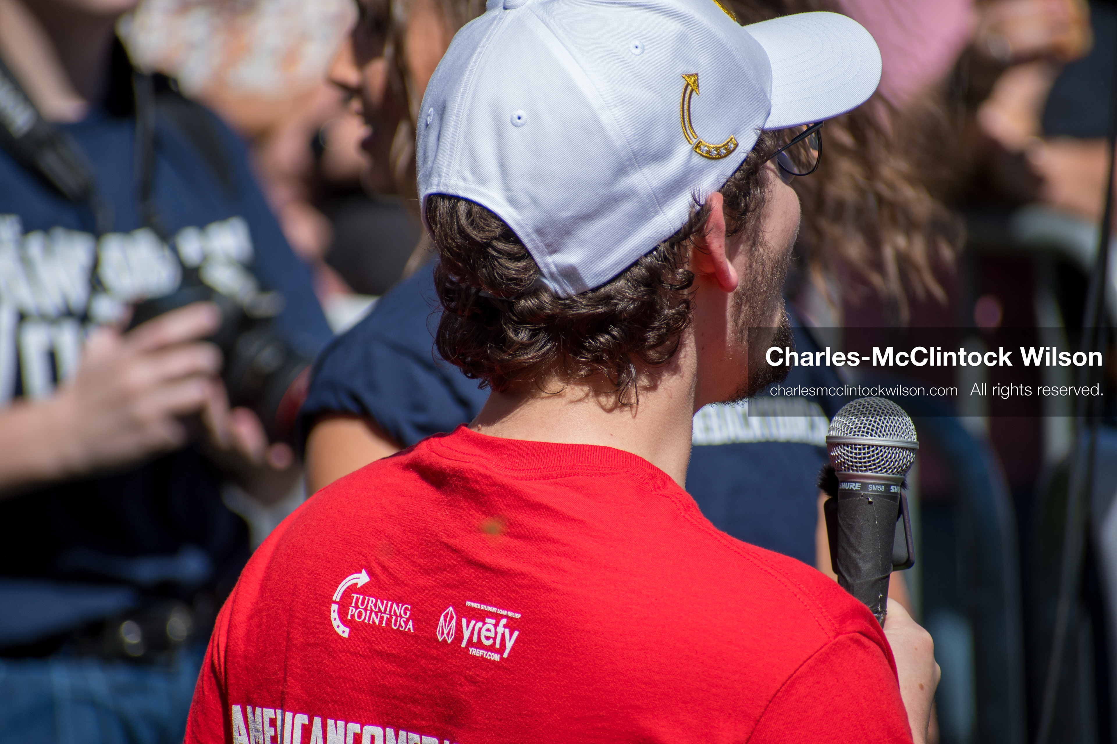 September 10, 2025, Orem, Utah, USA: A staff member from Turning Point USA speaks into a microphone during conservative activist Charlie Kirk’s American Comeback Tour appearance at Utah Valley University. The event, held at the Fountain Courtyard, drew over 3,000 attendees and was marked by heightened civic tension and symbolic gestures from across the political spectrum. Kirk was fatally shot moments later during the public Q&A session, prompting national scrutiny of campus security protocols and institutional response. (Credit Image: © Charles‑McClintock Wilson/All rights reserved)