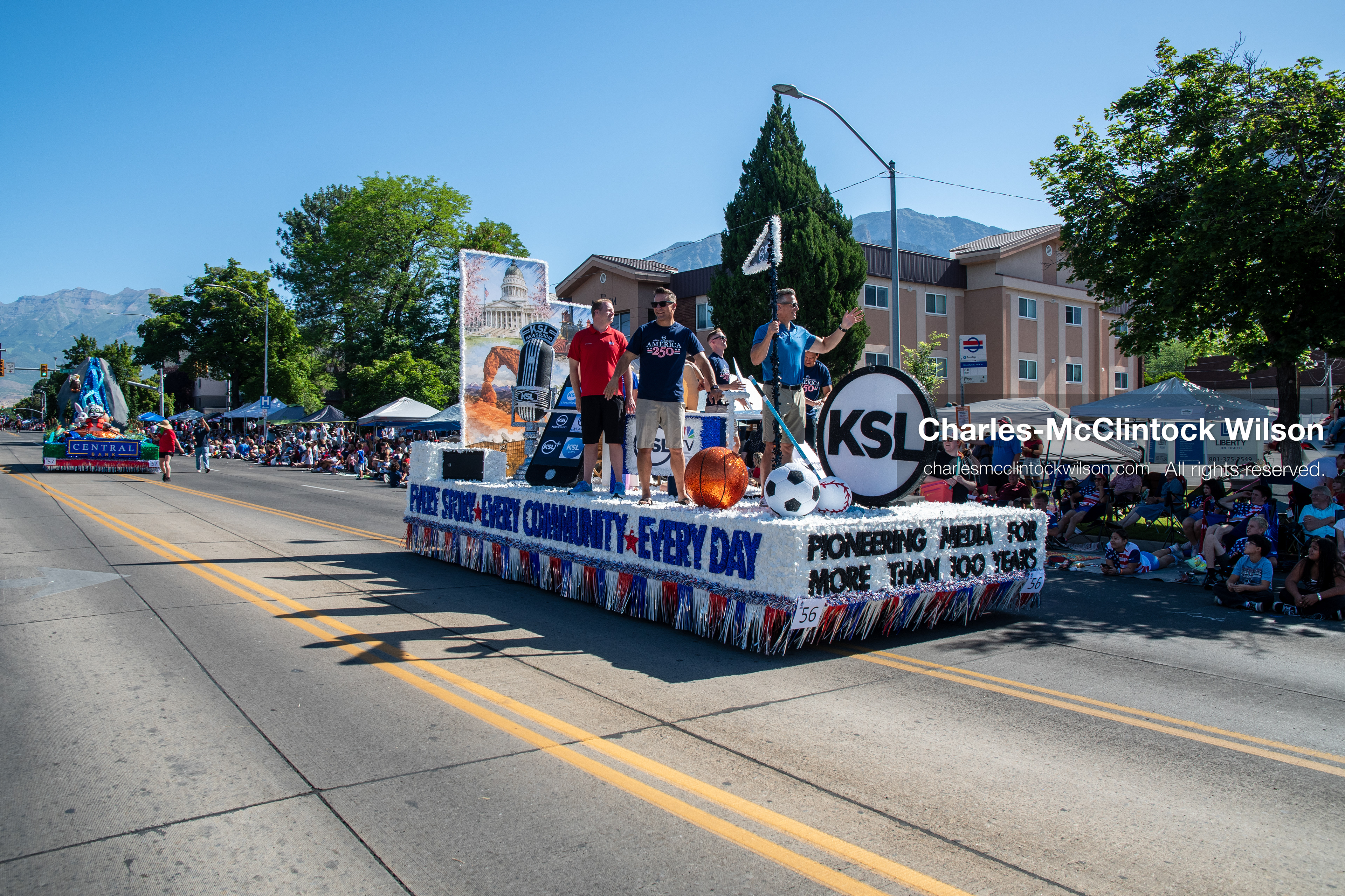July 4, 2026, Provo, Utah, USA: Representatives from KSL NewsRadio and KSL TV wave to the crowd from a corporate parade float during America's Freedom Festival Grand Parade in Provo, Utah, Saturday, July 4, 2026. The annual Independence Day event features expanded programming to honor the 250th anniversary of United States independence. (Credit Image: © Charles-McClintock Wilson/ZUMA Press Wire)