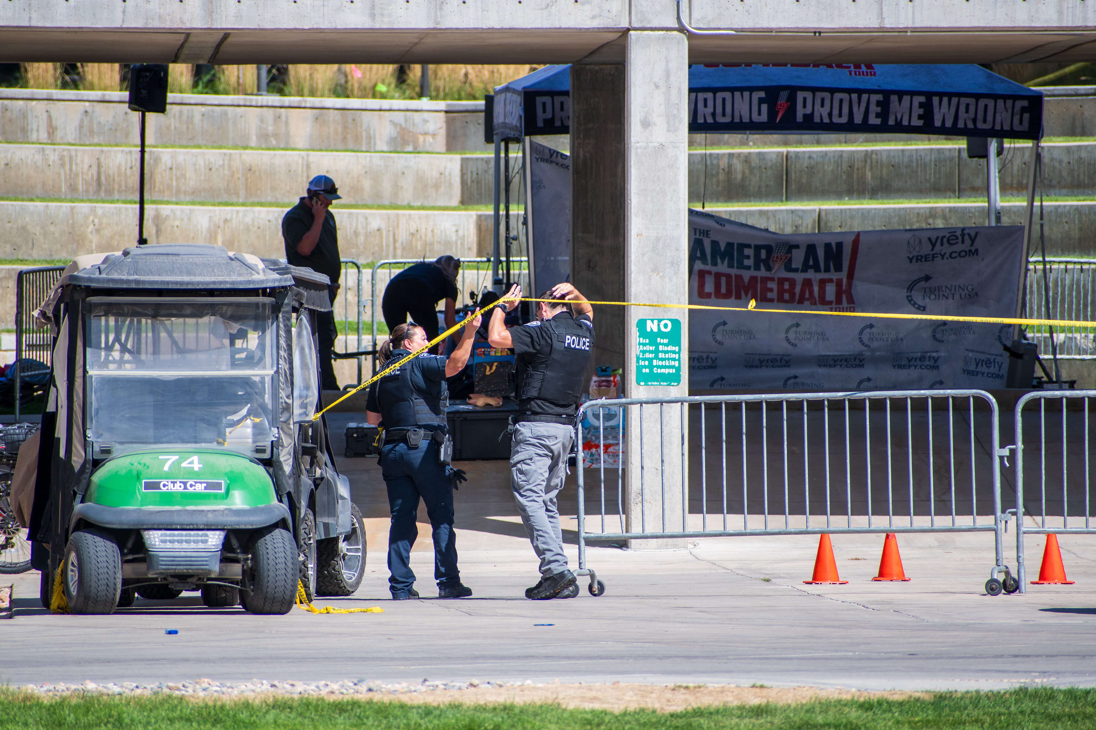 September 12, 2025 – Orem, Utah, United States: Police officers secure an area with caution tape near a tented display at Utah Valley University following the fatal shooting of conservative activist Charlie Kirk, who was assassinated during a public event on campus two days earlier. Photograph by Charles‑McClintock Wilson / ZUMA Press Wire