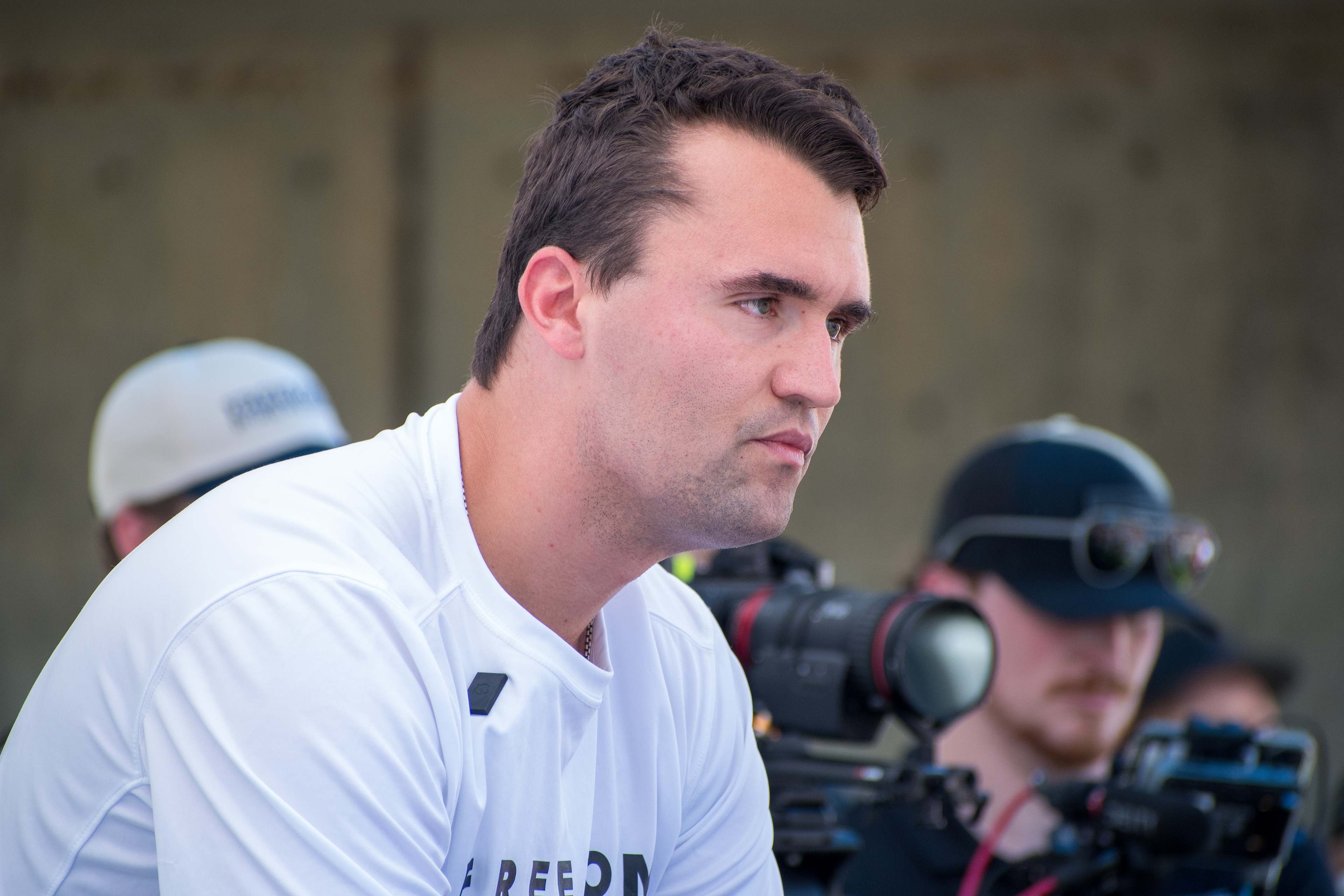  OREM, UTAH – SEPTEMBER 10, 2025: Charlie Kirk appears focused and resolute during a public event at Utah Valley University. Captured in a moment of quiet intensity, Kirk looks off-camera as media lenses track his movements. The image reflects the tension and conviction that defined his final public appearance before the shooting incident that disrupted the event. © Charles-McClintock Wilson / ZUMA Press