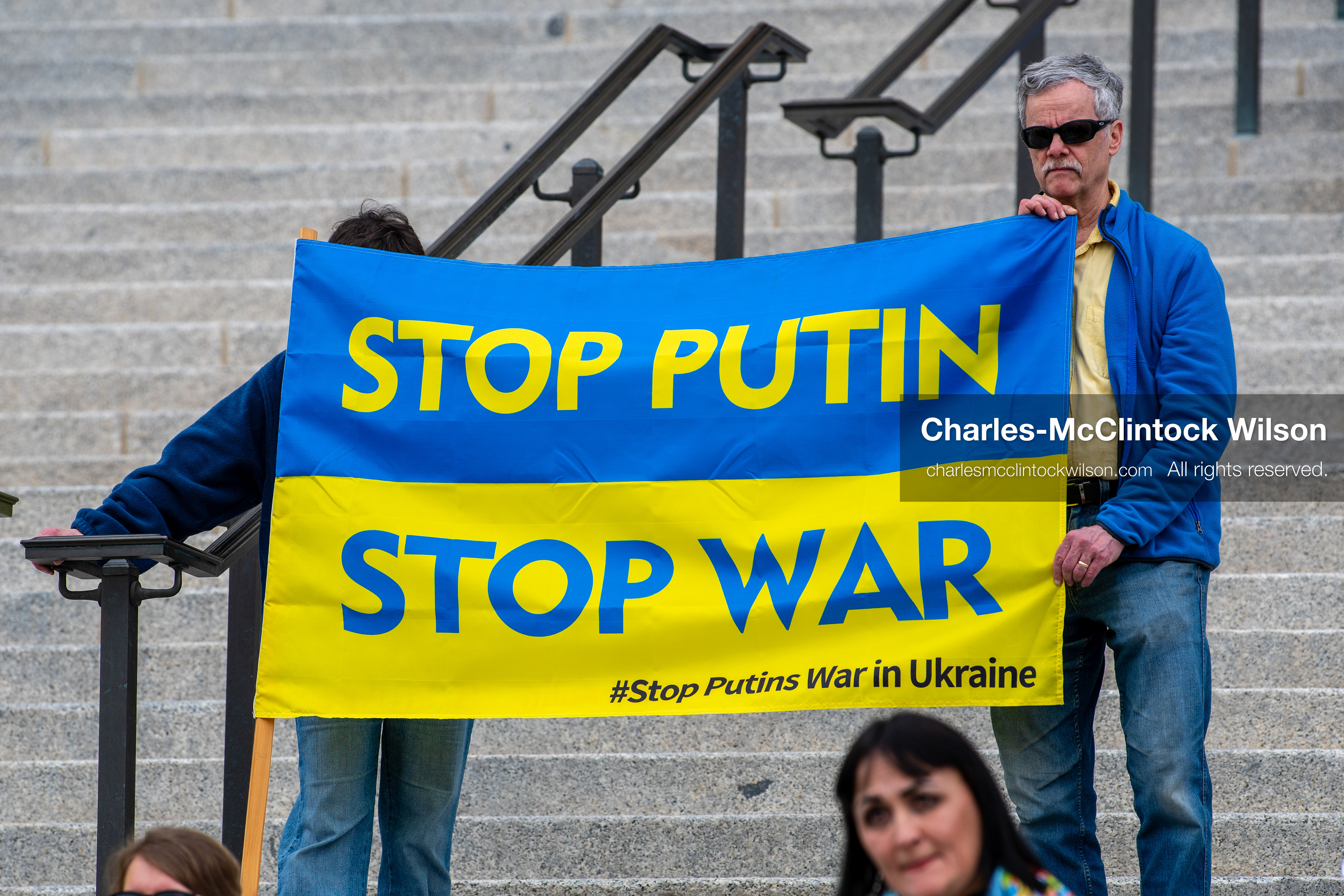  February 28, 2026, Salt Lake City, Utah, USA: Demonstrators hold a large blue and yellow banner resembling the Ukrainian flag with the words Stop Putin Stop War during the Stand With Ukraine rally at the Utah State Capitol. The gathering marked the four year anniversary of the full scale Russian invasion of Ukraine and brought community members together in support of Ukrainians and local humanitarian efforts. (Credit Image: © Charles McClintock Wilson/ZUMA Press Wire)