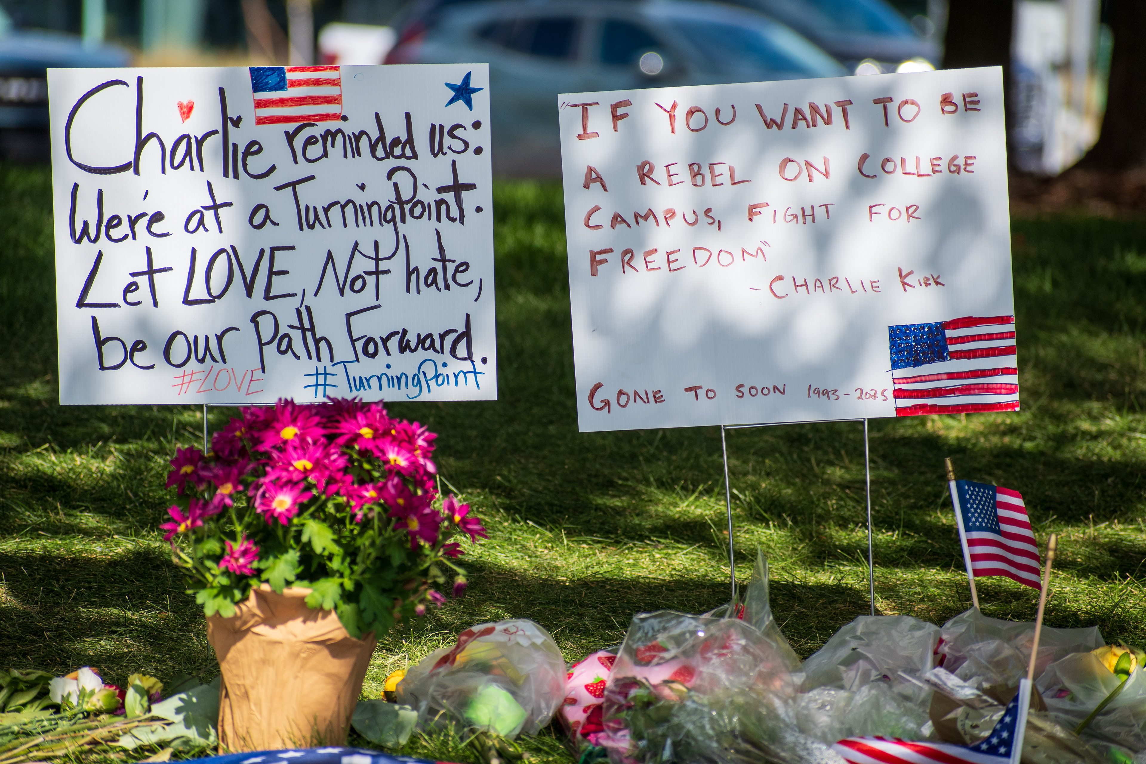 OREM, UTAH – SEPTEMBER 15, 2025: A memorial honoring Charlie Kirk is seen on the campus of Utah Valley University, featuring American flags, candles, flowers, and handwritten signs arranged around a large portrait. The tribute appeared days after Kirk’s final public event at the university. © Charles‑McClintock Wilson / ZUMA Press