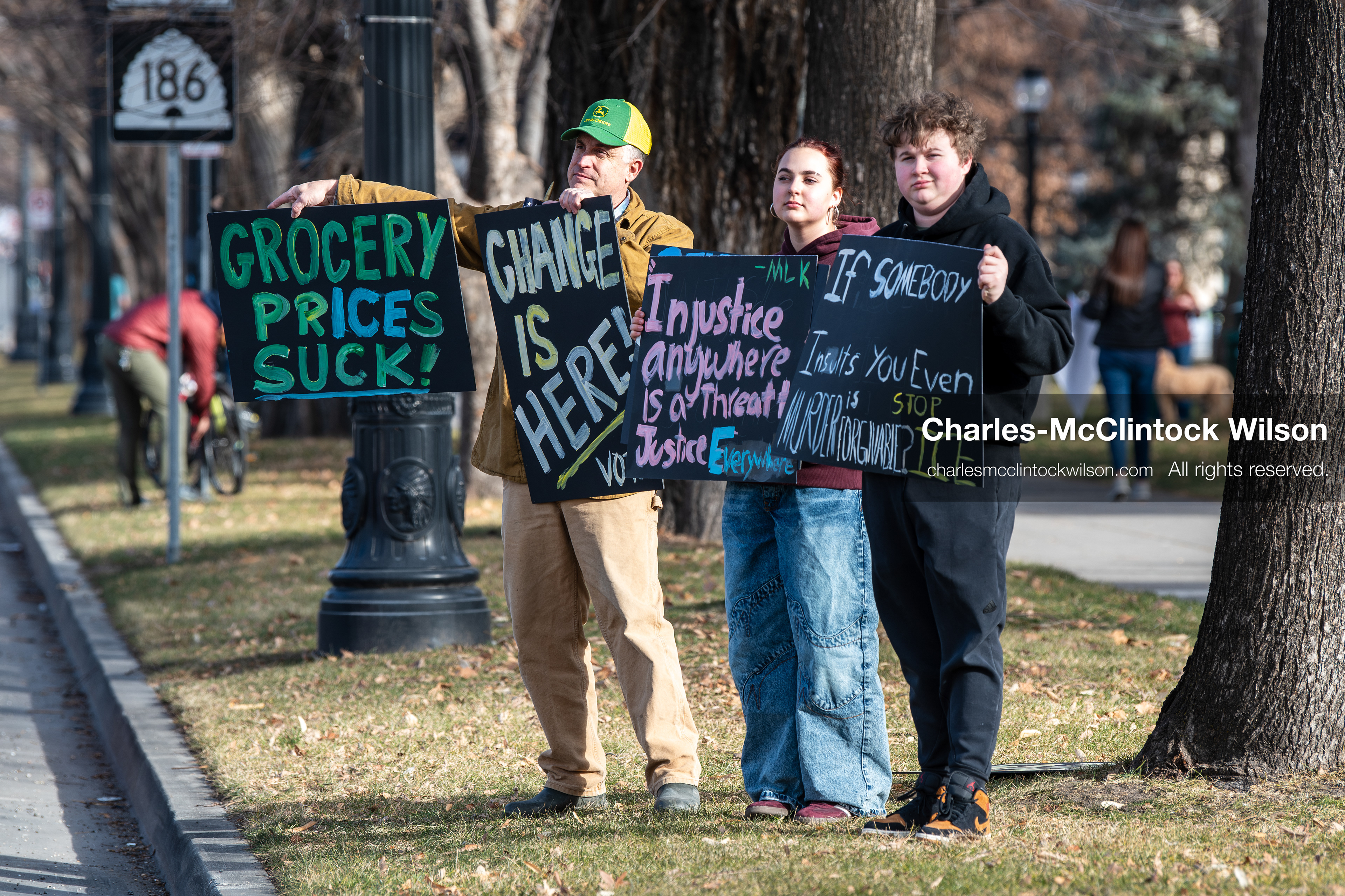 January 30, 2026, Salt Lake City, Utah, USA: Demonstrators hold signs on a sidewalk at Washington Square Park during an anti‑ICE protest in Salt Lake City, part of a nationwide response to immigration enforcement policies. (Credit Image: © Charles‑McClintock Wilson/ZUMA Press Wire)