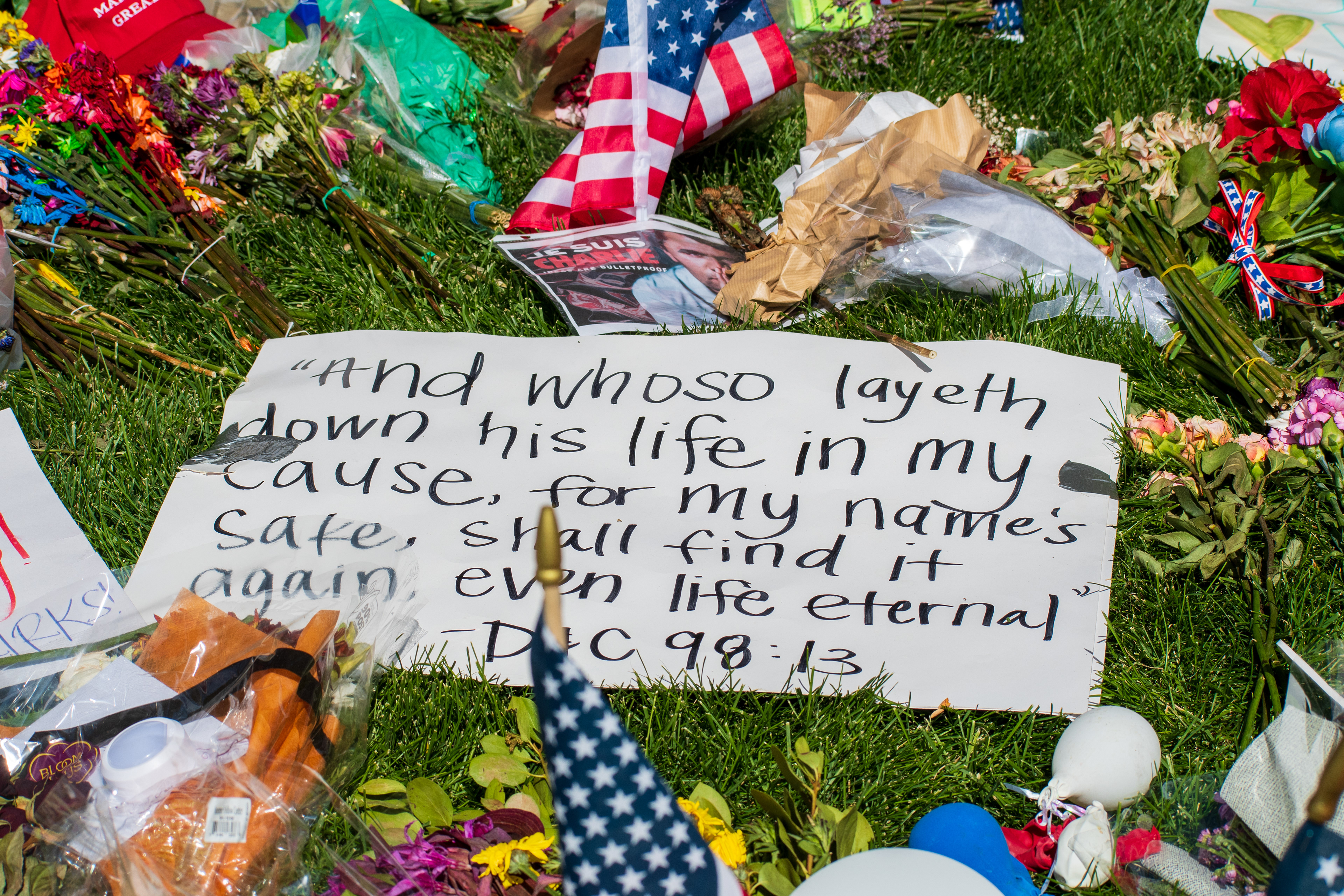 OREM, UTAH – SEPTEMBER 15, 2025: A memorial honoring Charlie Kirk is seen on the campus of Utah Valley University, featuring American flags, candles, flowers, and handwritten signs arranged around a large portrait. The tribute appeared days after Kirk’s final public event at the university. © Charles‑McClintock Wilson / ZUMA Press