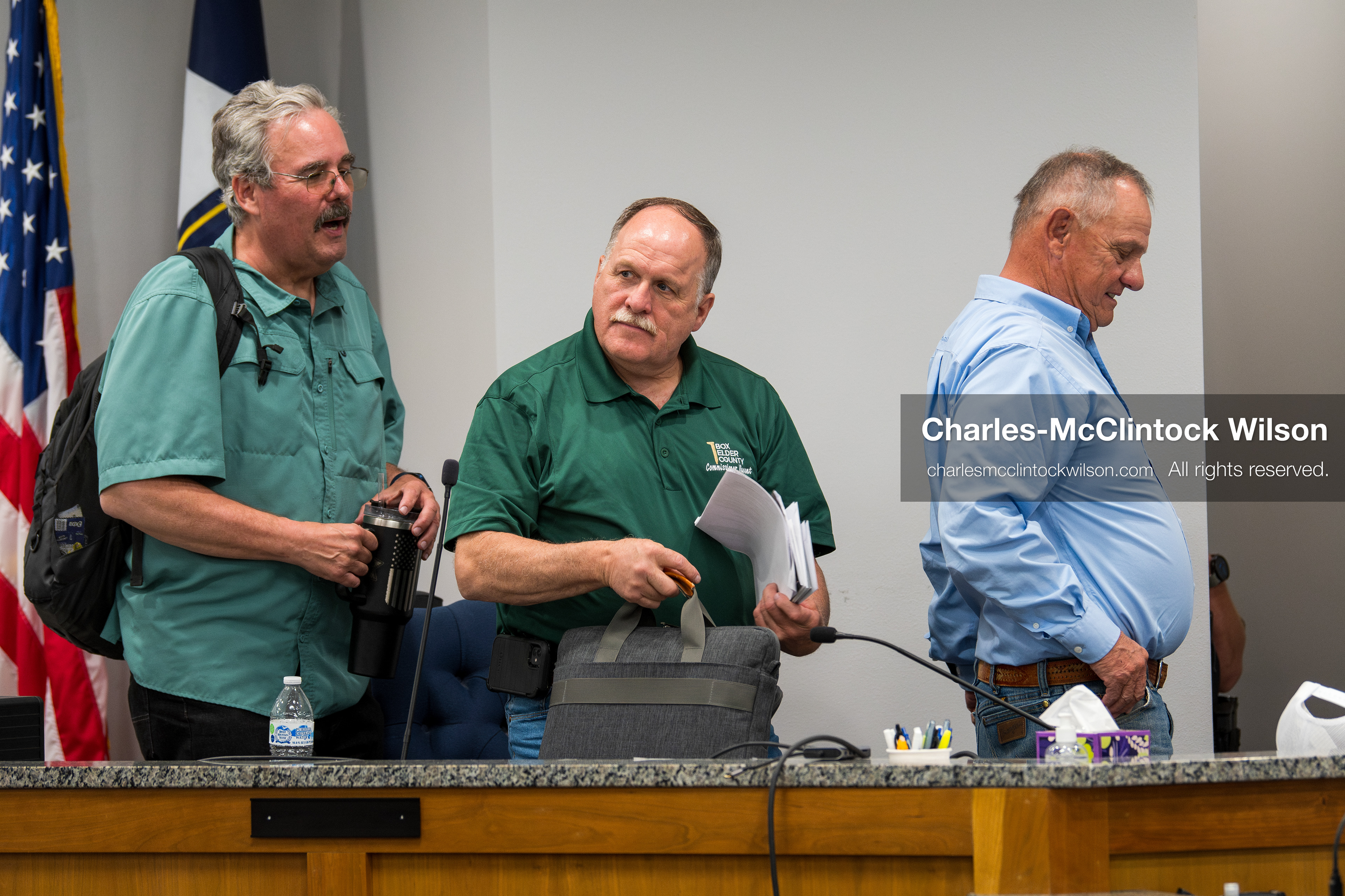May 13, 2026, Brigham City, Utah, USA: Box Elder County Commissioners, from left to right, LEE PERRY, TYLER VINCENT, and BOYD BRIGHAM, gather their materials following the Box Elder County Commission meeting inside the Box Elder County Justice Center in Brigham City, Utah. The meeting addressed the proposed data‑center project backed by businessman Kevin O’Leary, which has drawn public concern over water use, power demand, and transparency. (Credit Image: © Charles‑McClintock Wilson/ZUMA Press Wire)