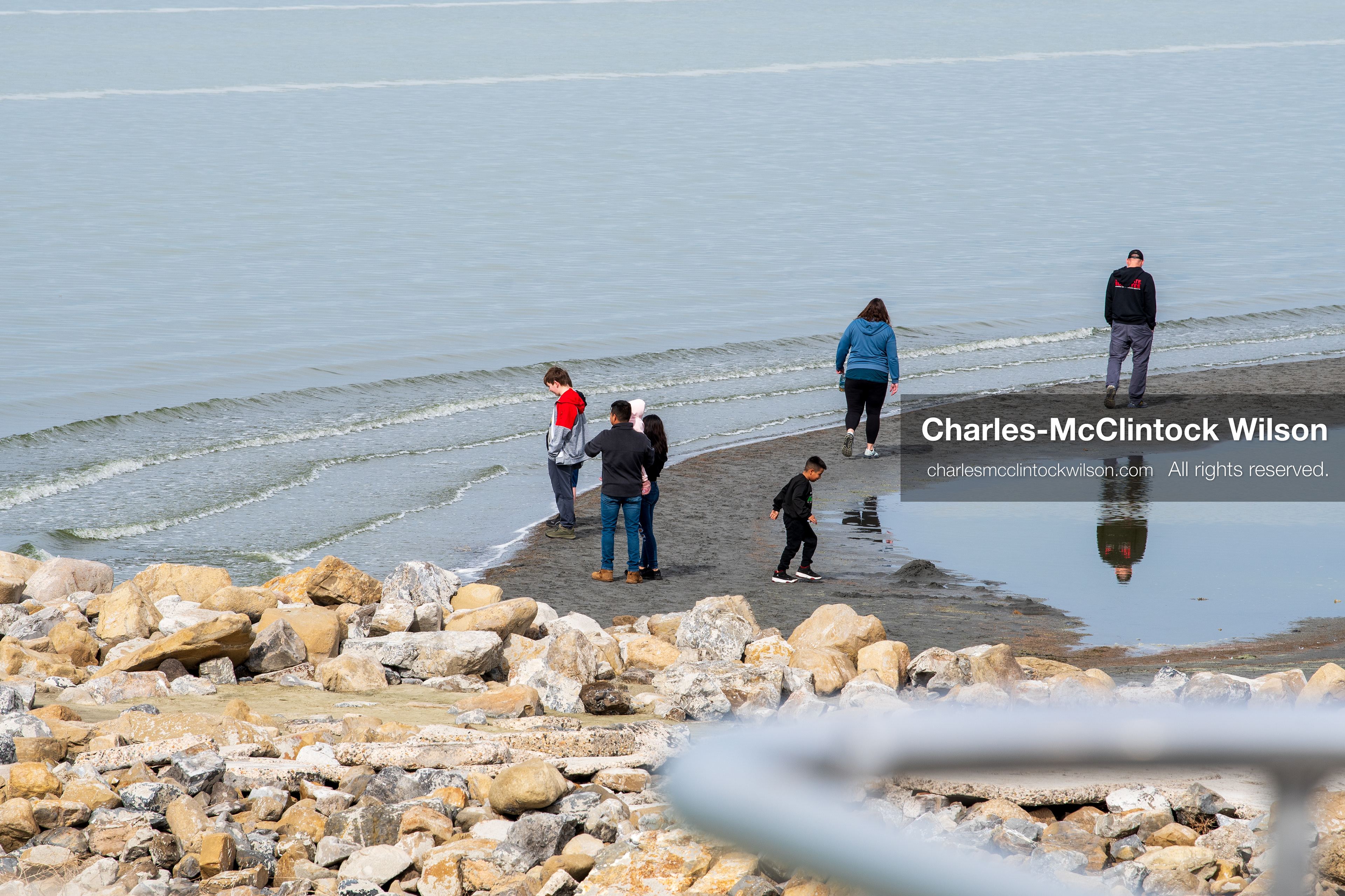 March 1, 2026, Great Salt Lake, Utah, USA: People walk along the shoreline of the Great Salt Lake as water levels remain historically low. Reports from state officials and the Great Salt Lake Strike Team state that the lake continues to fall within a serious adverse‑effects range, with elevations among the lowest recorded in more than one hundred years. The lake has drawn increased public attention as lawmakers consider large‑scale water projects and long‑term plans to address declining conditions. (Credit Image: © Charles‑McClintock Wilson/ZUMA Press Wire)
