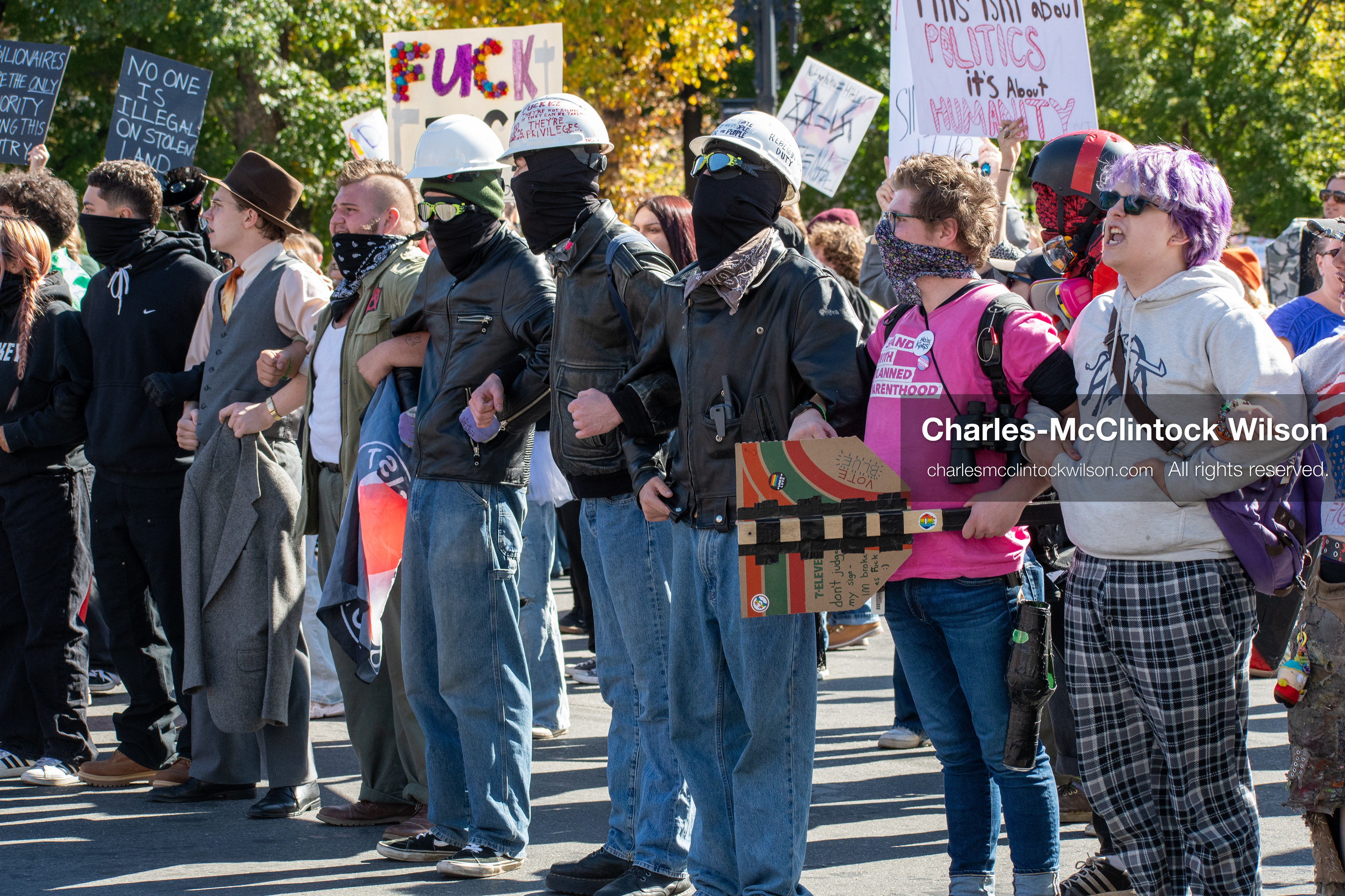 October 18, 2025, Salt Lake City, Utah, USA: Demonstrators link arms during a "No Kings" protest on South State Street in Salt Lake City, Utah. The protest was part of a nationwide mobilization.