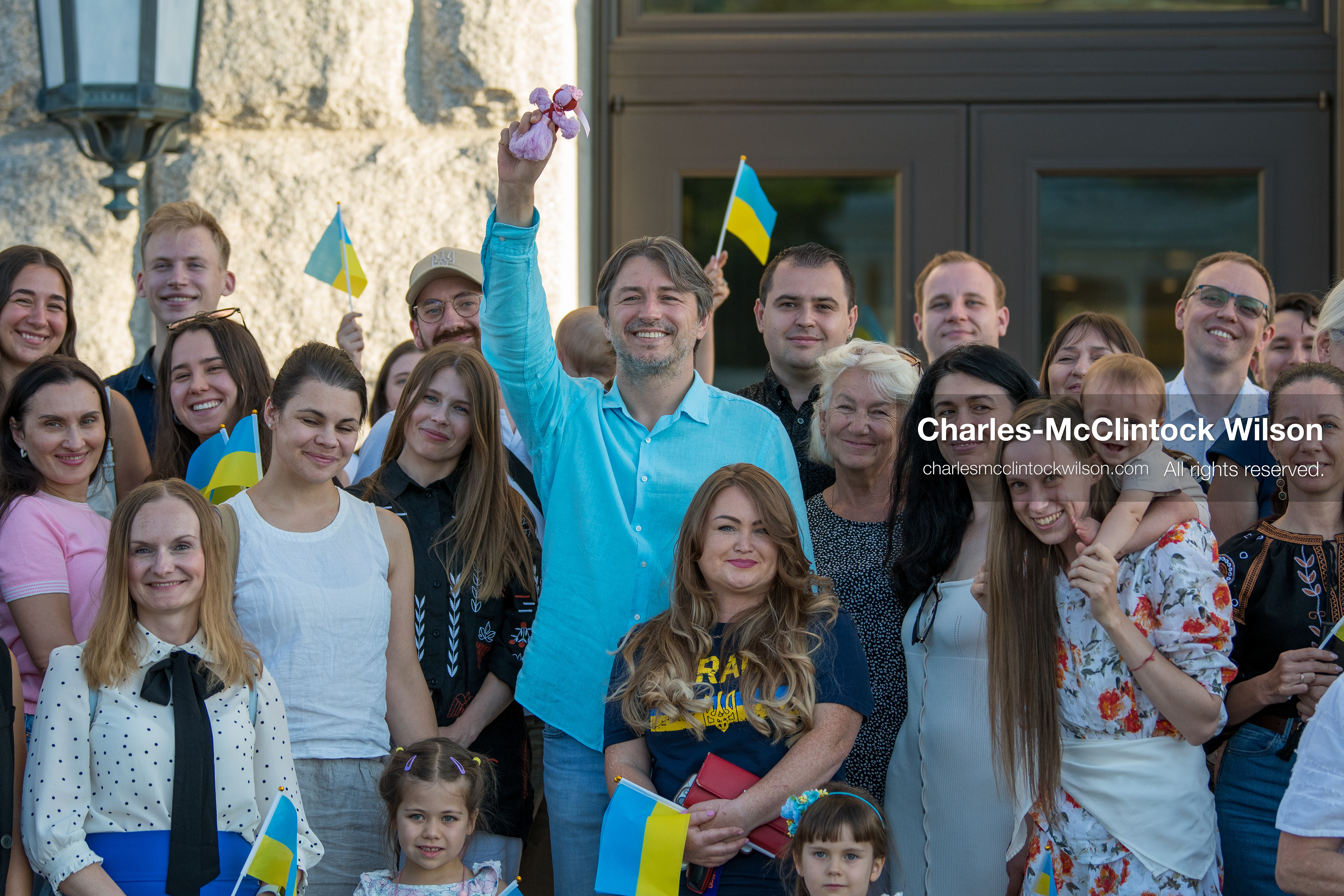 July 23, 2026, Salt Lake City, Utah, USA: Ukrainian activist SERHIY PRYTULA holds a small doll while posing for a group photograph with supporters during a community meeting at the Utah State Capitol building in Salt Lake City, Utah, on Thursday, July 23, 2026. The event, titled ''Ukraine in the Fifth Year of the Full-Scale War: An Honest Conversation,'' was hosted by the Prytula Foundation USA to discuss civil defense and ongoing humanitarian aid initiatives. (Credit Image: © Charles-McClintock Wilson/ZUMA Press Wire)