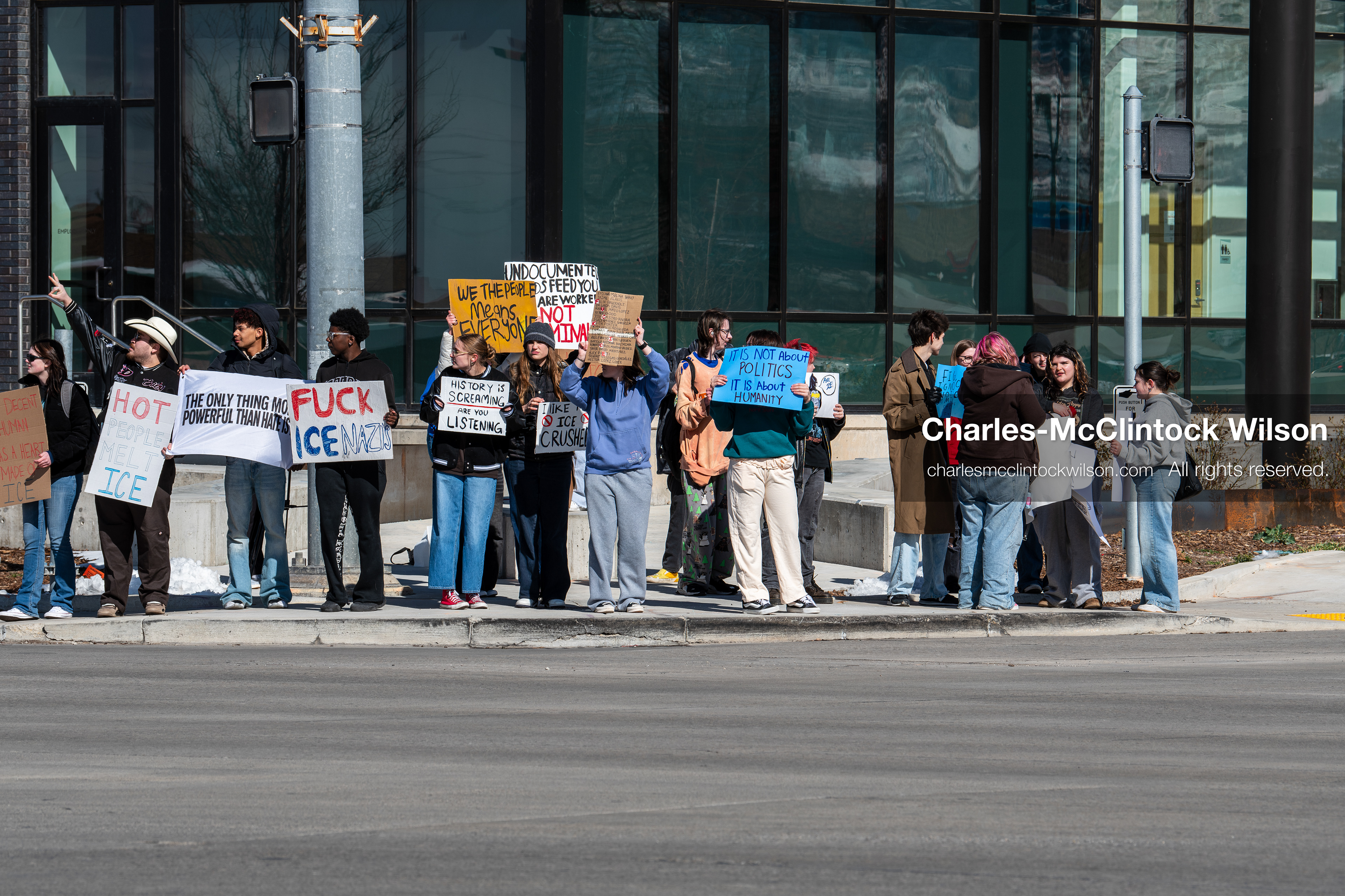 February 20, 2026, Orem, Utah, USA: High school students gather along State Street in front of Orem City Hall during a student led protest against ICE and federal immigration enforcement. Demonstrators hold signs as they stand near the roadway while traffic continues through the area. (Credit Image: © Charles McClintock Wilson/ZUMA Press Wire)