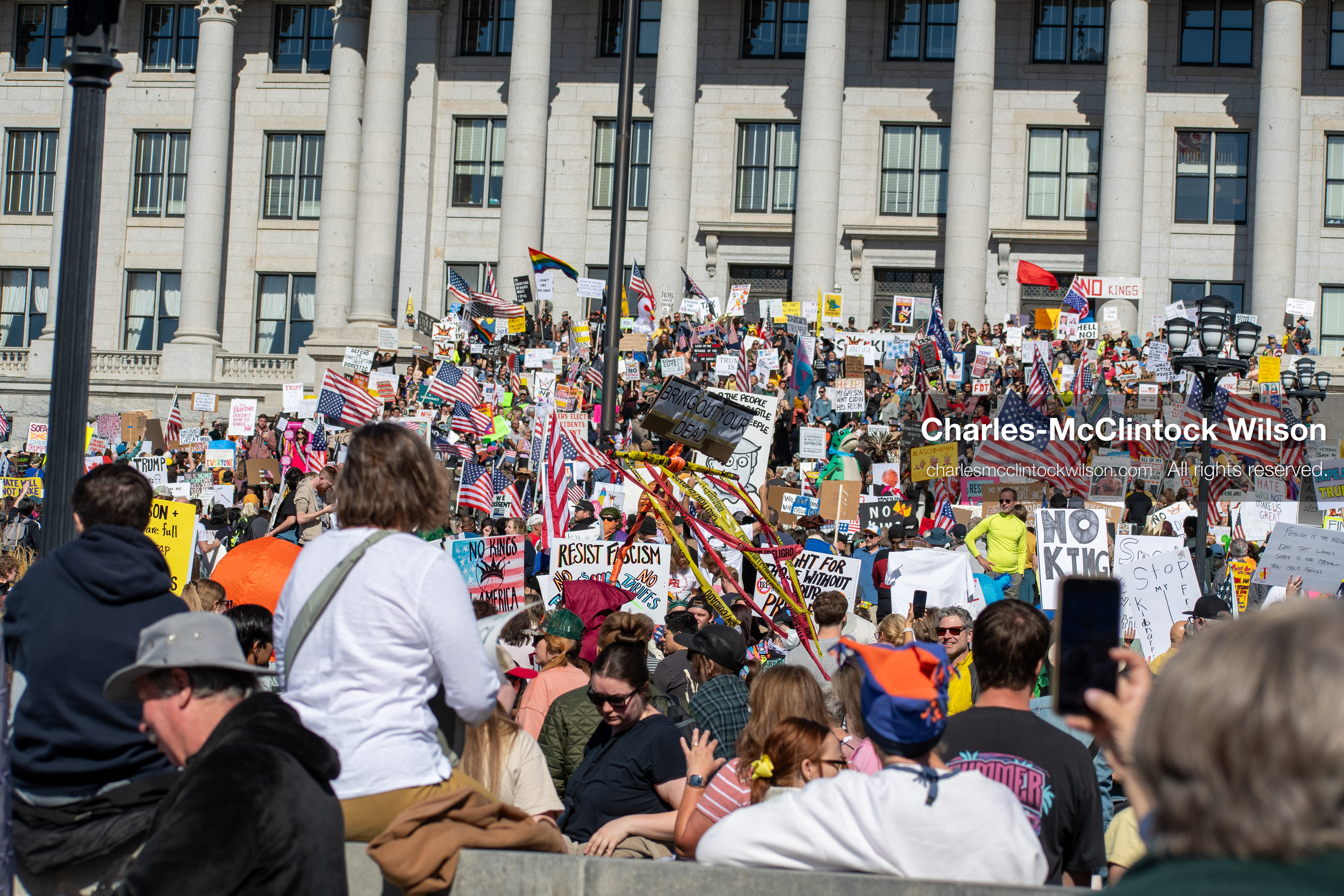 October 18, 2025, Salt Lake City, Utah, USA: Demonstrators participate in a "No Kings" protest held at the Utah State Capitol. Participants hold signs and flags during the public gathering.