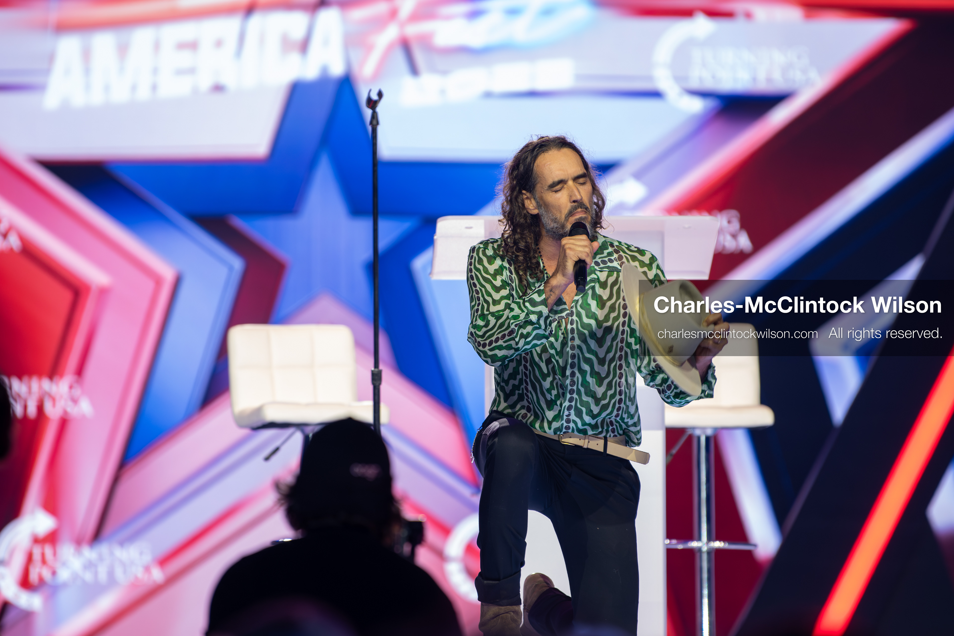 December 18, 2025, Phoenix, Arizona, USA: Russell Brand speaks during Day One of Turning Point USA’s AmericaFest 2025 at the Phoenix Convention Center in Phoenix, Arizona.   (Credit Image: © Charles‑McClintock Wilson/ZUMA Press Wire)