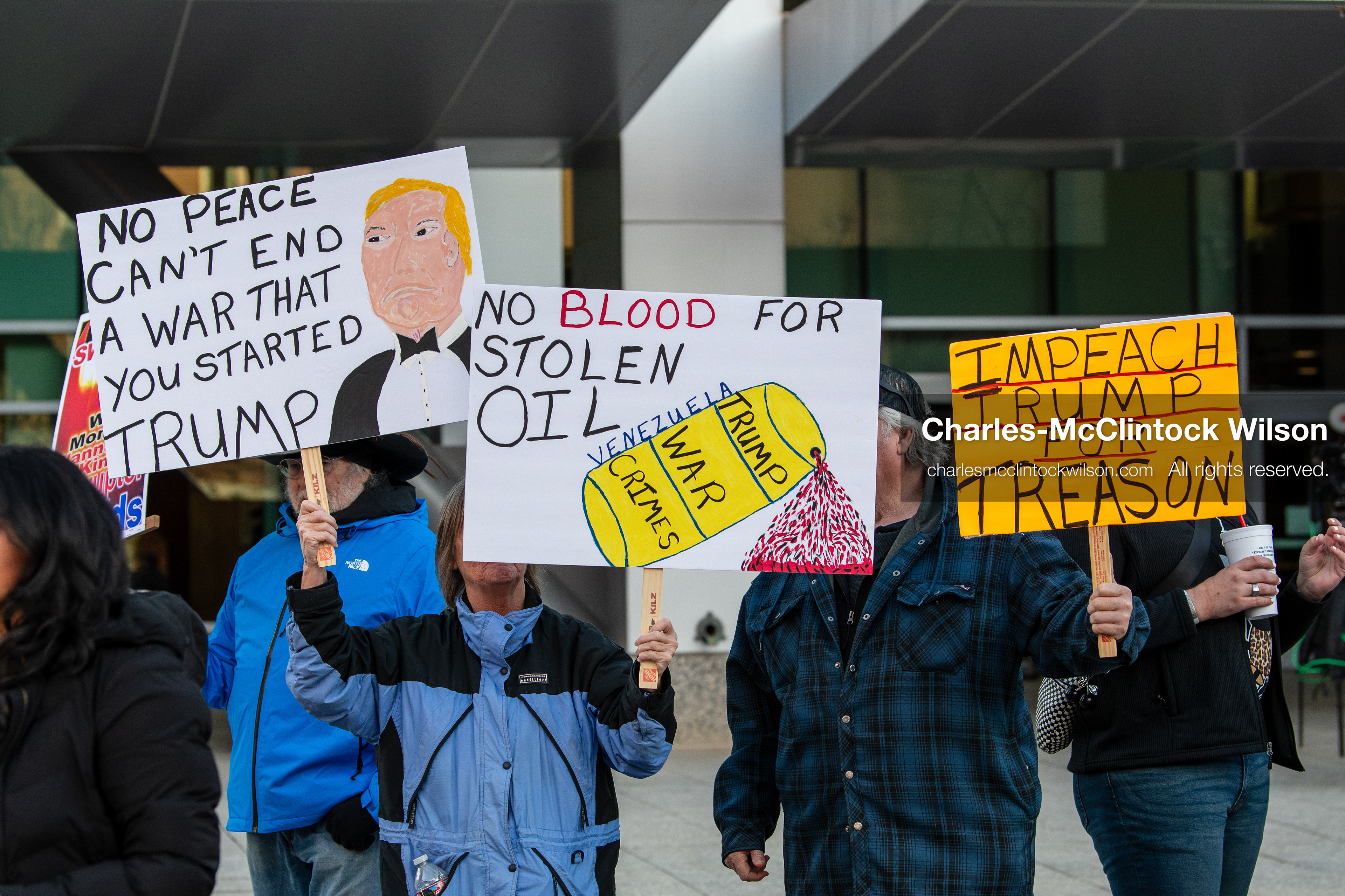 January 5, 2026, Salt Lake City, Utah, USA: Demonstrators hold signs during a protest outside the Wallace Federal Building in Salt Lake City, Utah. The rally, organized by Salt Lake Indivisible, called for congressional limits on presidential war powers following recent US military actions in Venezuela involving the government of Nicolas Maduro. (Credit Image: (c) Charles‑McClintock Wilson/ZUMA Press Wire)