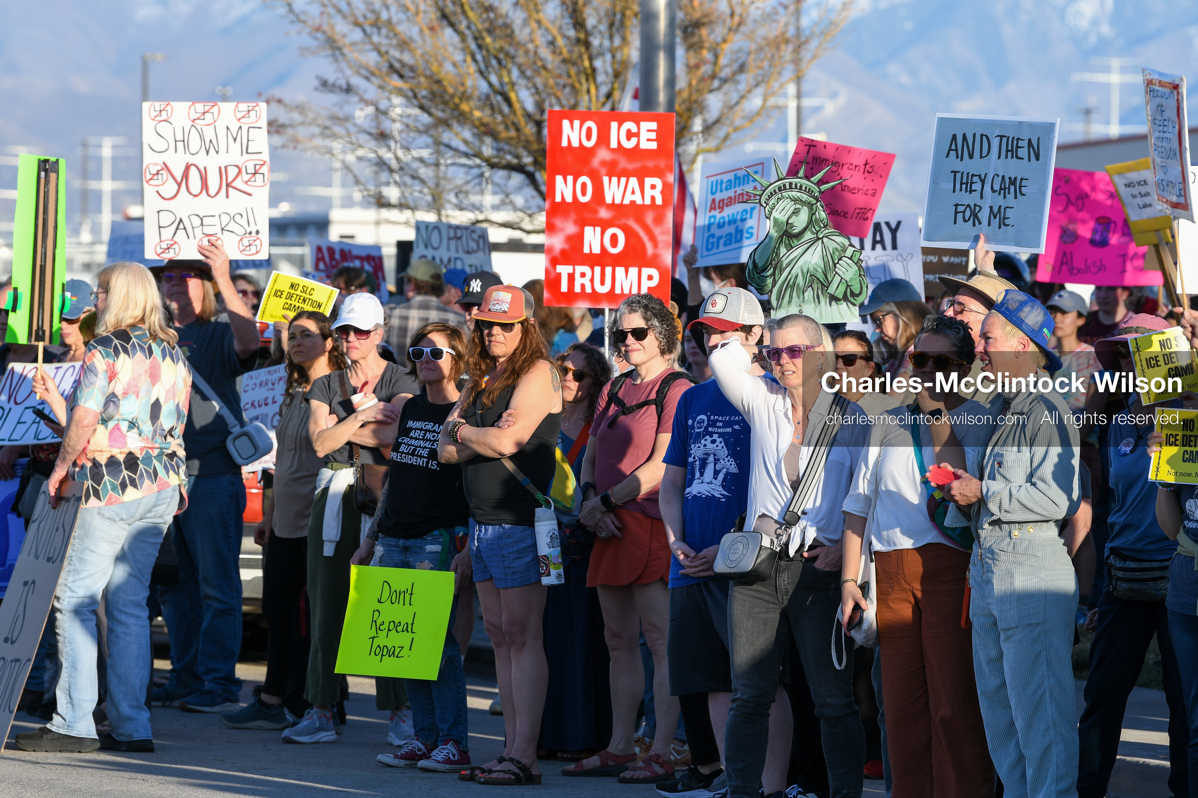 March 18, 2026, Salt Lake City, Utah, USA: People hold signs during a protest at the site of a proposed ICE detention facility on the west side of Salt Lake City. Demonstrators gathered near the warehouse property as part of an ongoing community response to the planned facility. (Credit Image: © Charles McClintock Wilson/ZUMA Press Wire)