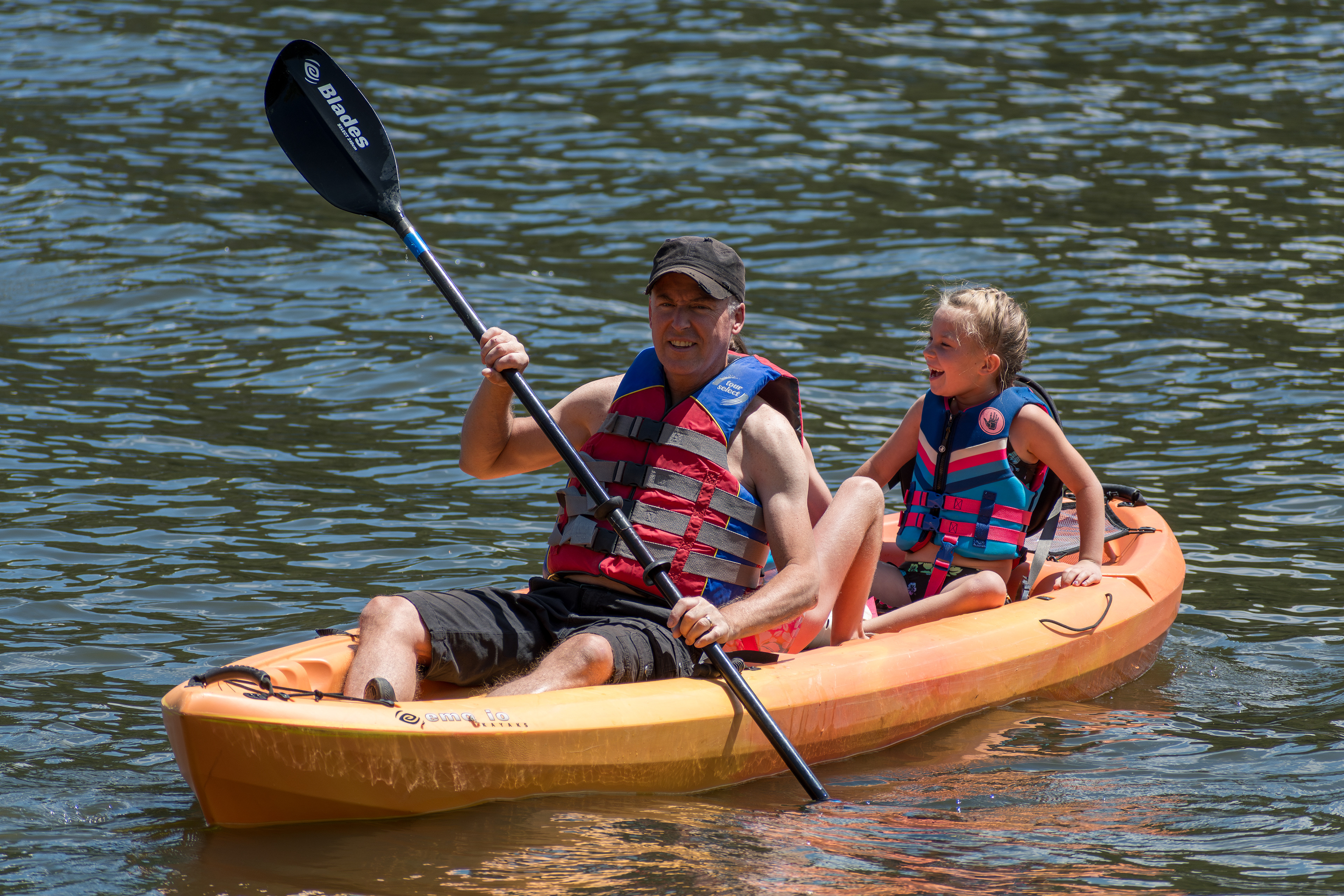 Summit County, Utah – July 20, 2025: People paddle kayaks across the calm waters of Smith and Morehouse Reservoir during a summer outing.