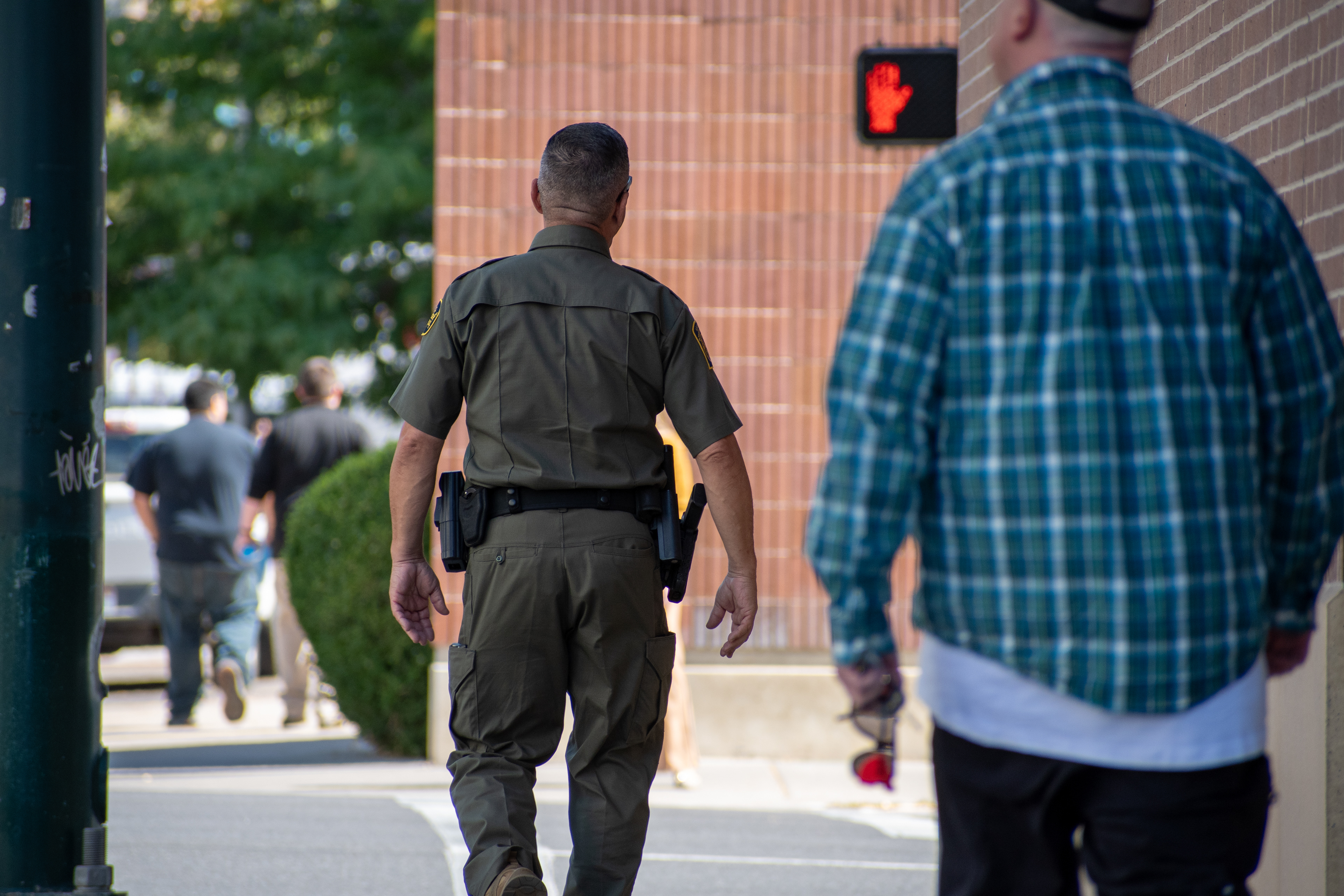 A U.S. Border Patrol agent walks near the Utah Valley Convention Center during a Department of Homeland Security career expo focused on recruiting law enforcement and security personnel. Photograph by Charles‑McClintock Wilson / ZUMA Press Wire