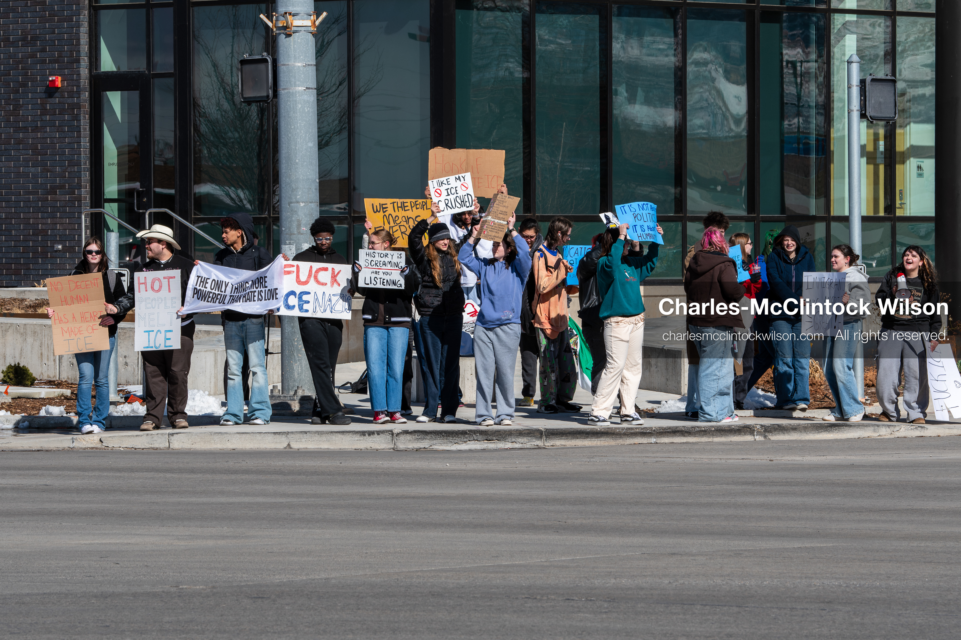 February 20, 2026, Orem, Utah, USA: High school students gather along State Street in front of Orem City Hall during a student led protest against ICE and federal immigration enforcement. Demonstrators hold signs as they stand near the roadway while traffic continues through the area. (Credit Image: © Charles McClintock Wilson/ZUMA Press Wire)