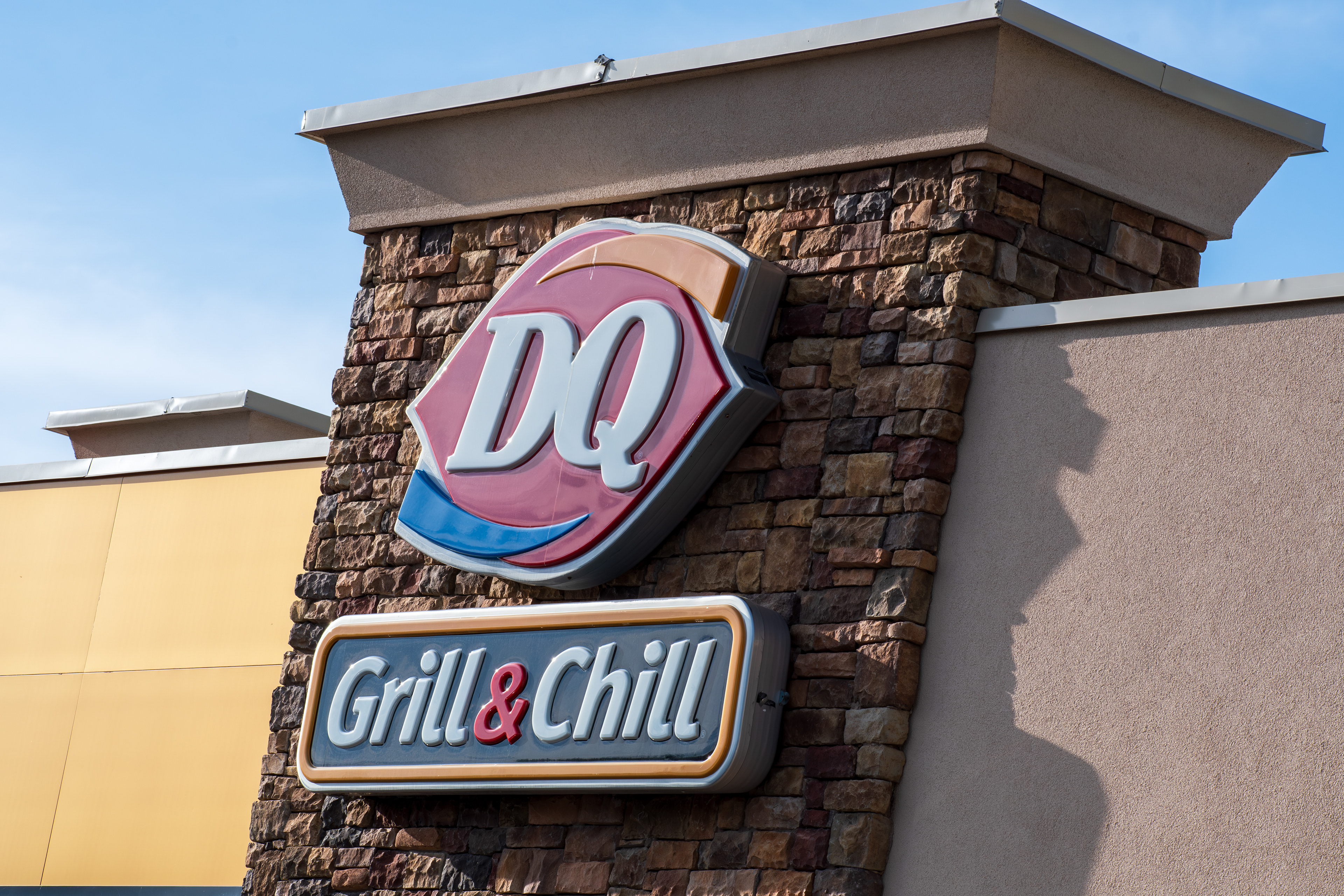 Spanish Fork, Utah, USA – May 28, 2025: The exterior of a (DQ) Dairy Queen Grill and Chill restaurant in Spanish Fork, Utah. 