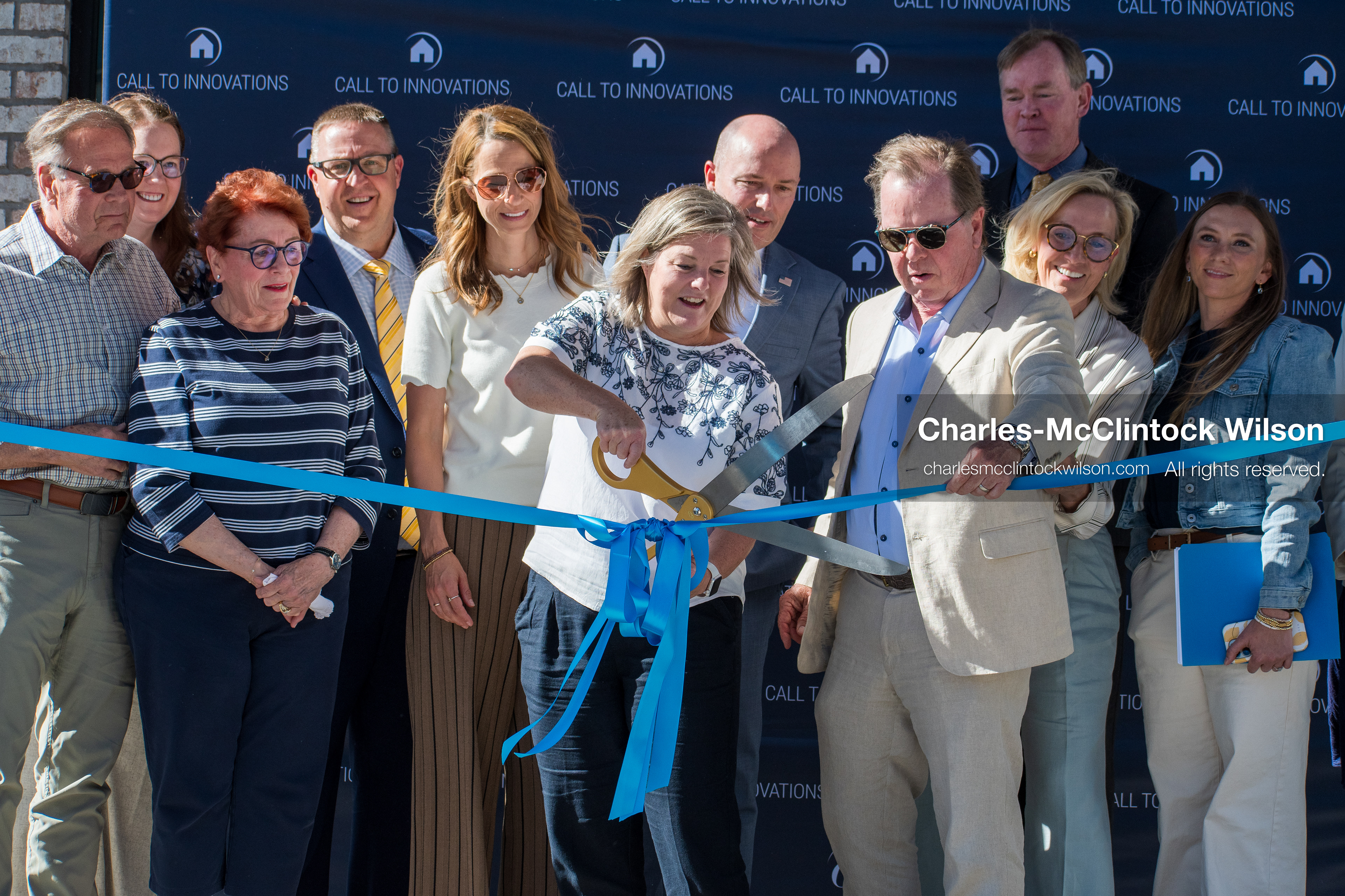 May 28, 2026, Lehi, Utah, USA: HEATHER TUCKER, director of the Lehi Literacy Center, holds the scissors as CLARK IVORY, cofounder and CEO of Ivory Homes, holds the ribbon during a ribbon cutting ceremony for the Lehi Literacy Center on May 28 2026 in Lehi Utah. (Credit Image: © Charles-McClintock Wilson/ZUMA Press Wire)