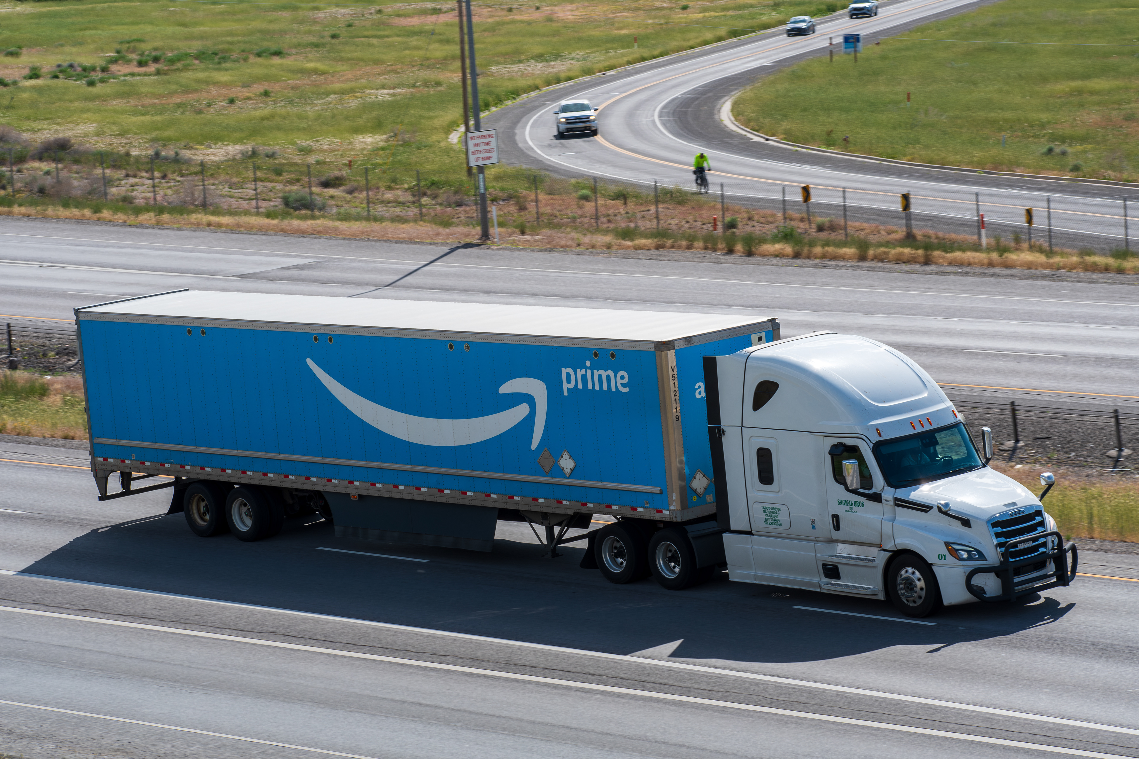 Santaquin, UT – June 8, 2025: An Amazon Prime truck travels northbound on Interstate 15 in Santaquin, Utah. Amazon Prime is a paid subscription service of Amazon which is available in many countries.