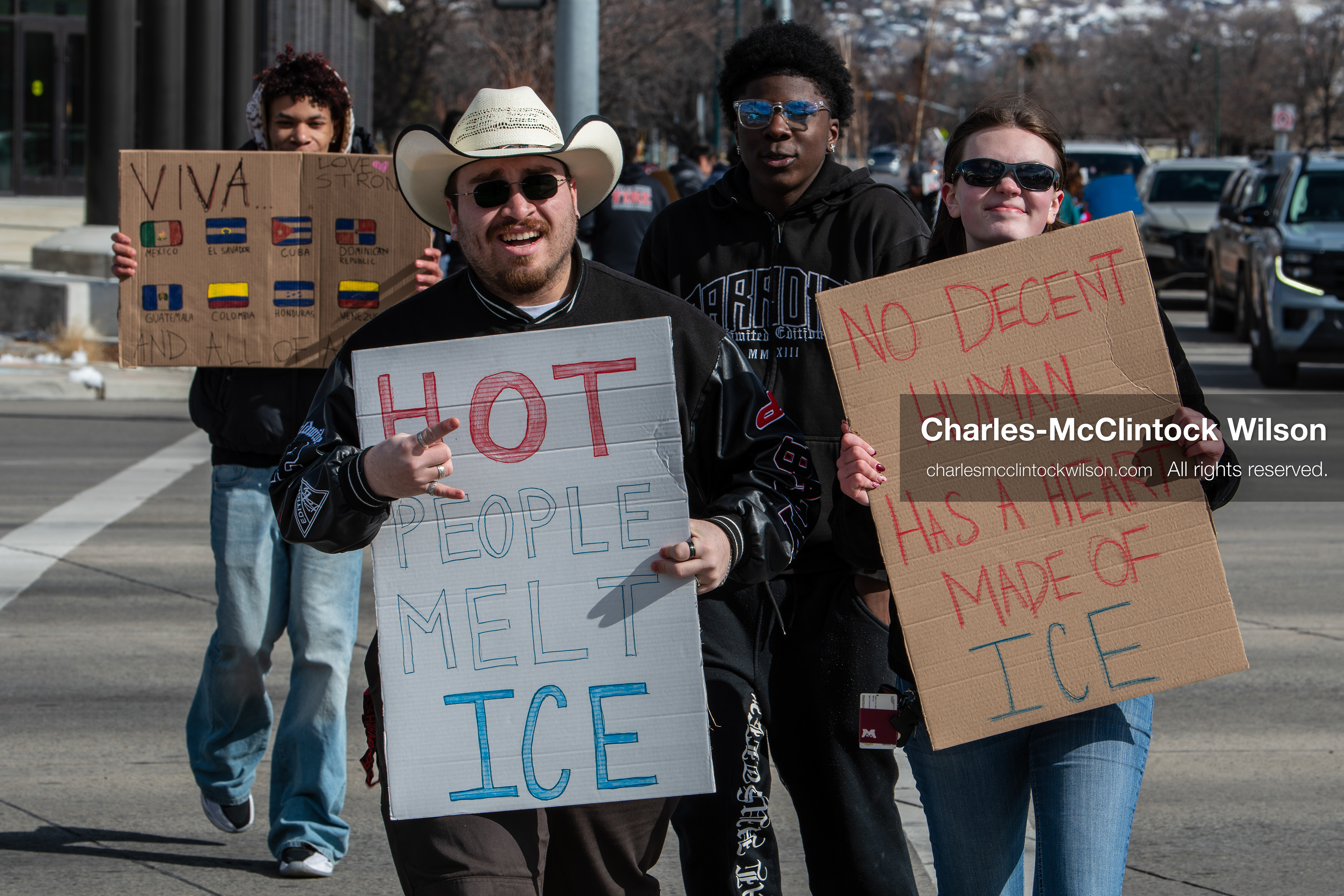 February 20, 2026, Orem, Utah, USA: Participants cross State Street in front of Orem City Hall during a student led protest against ICE. Demonstrators move through the crosswalk as vehicles wait in the area. (Credit Image: © Charles McClintock Wilson/ZUMA Press Wire)