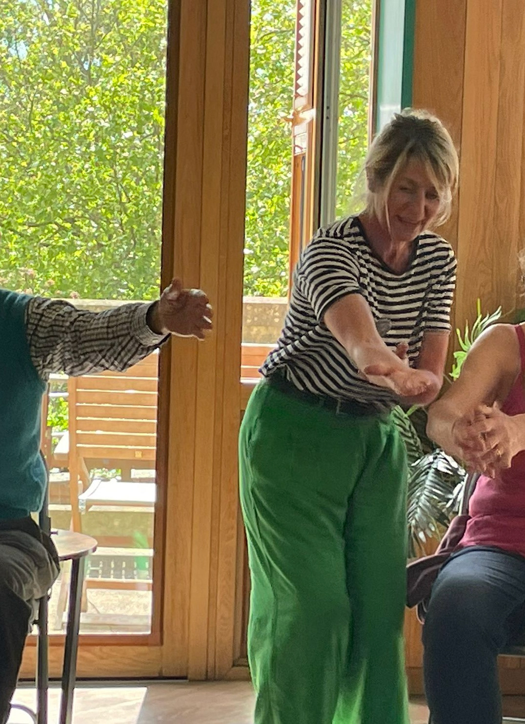 Stretching at the end of a seated dance session with ReMind UK