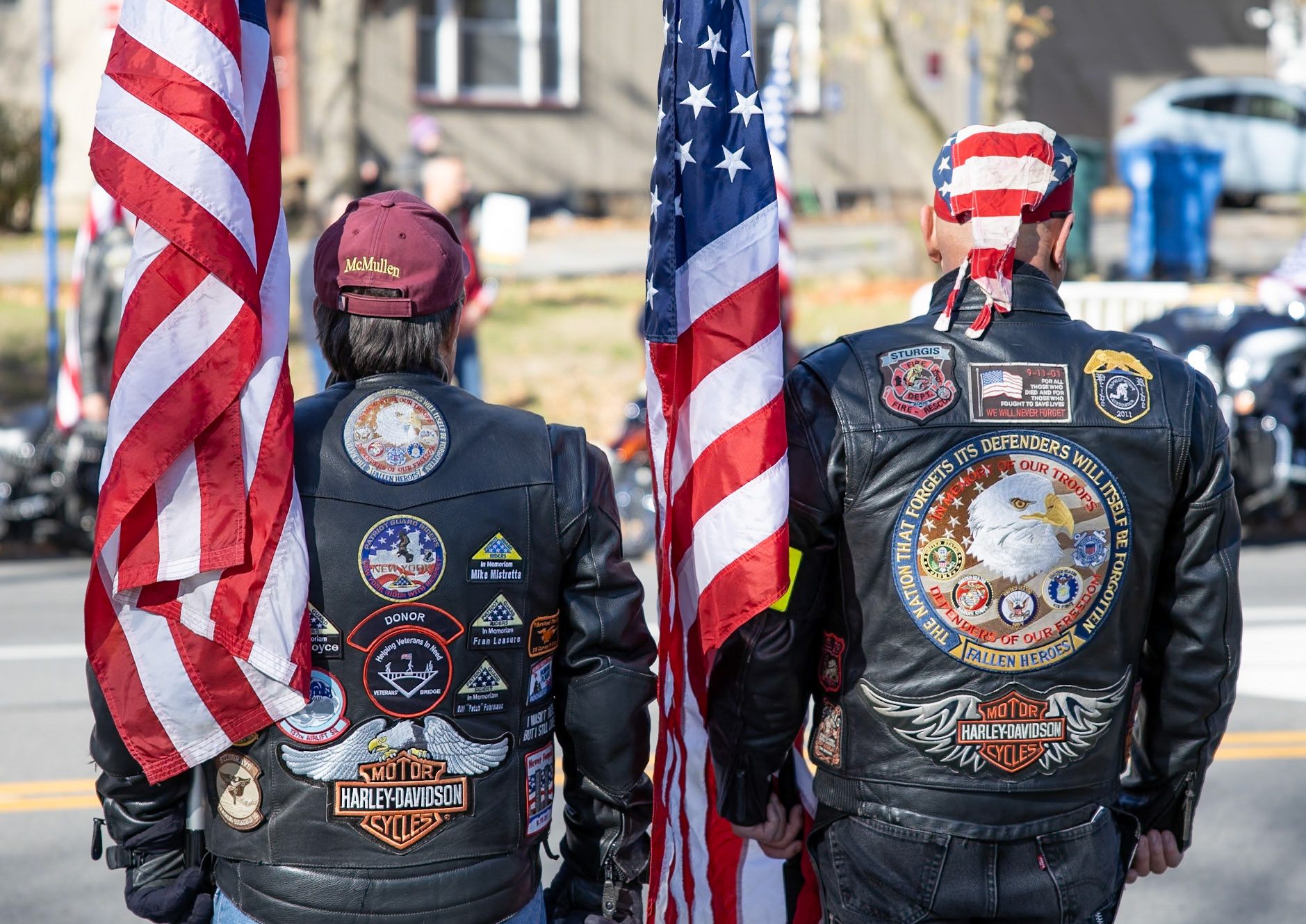 Two Patriot Guard riders stand proud in their motorcycle jacket to watch the Veterans Day parade in Rochester, New York on Nov. 9, 2024.