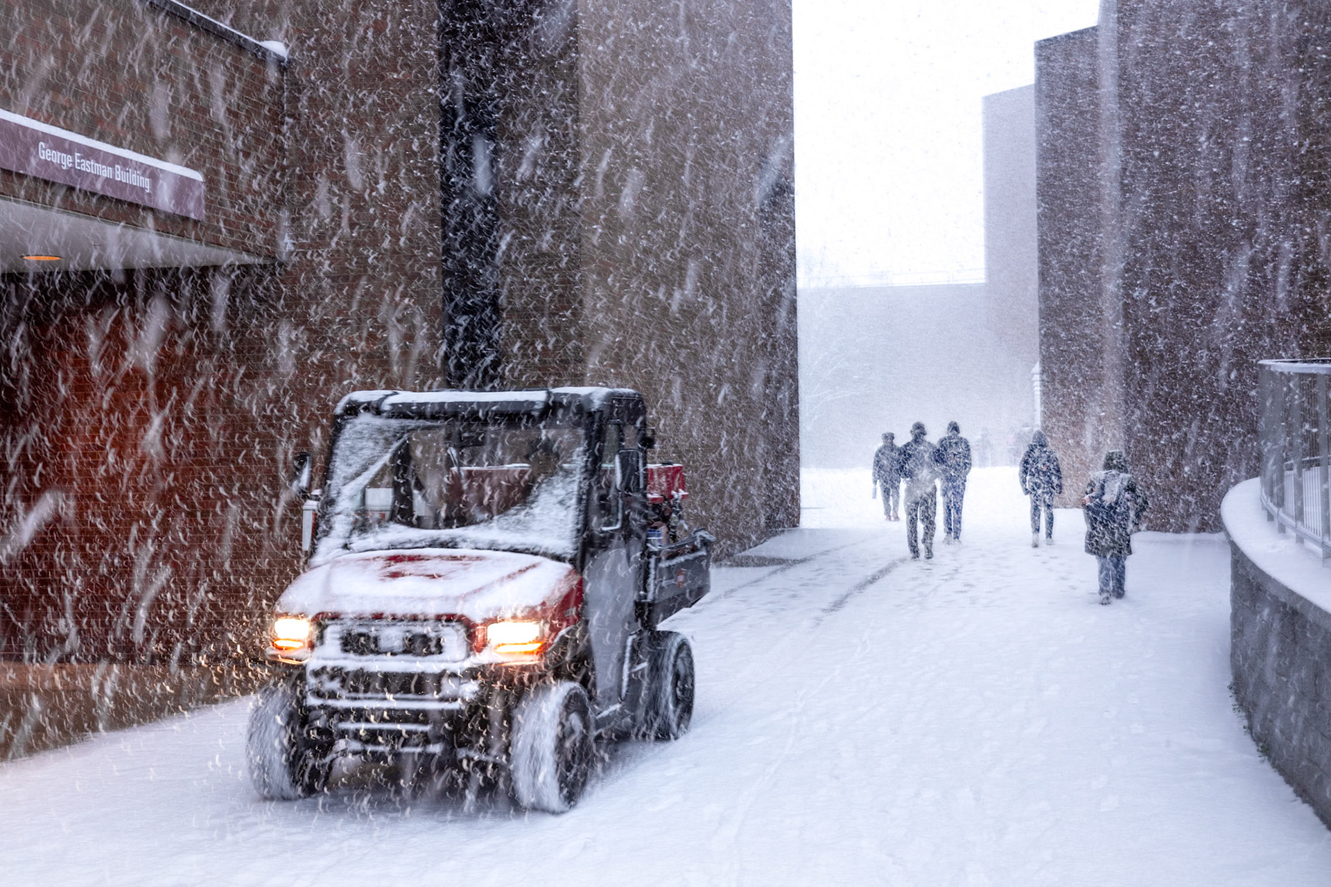 Students commuting from classes in a heavy snowstorm.