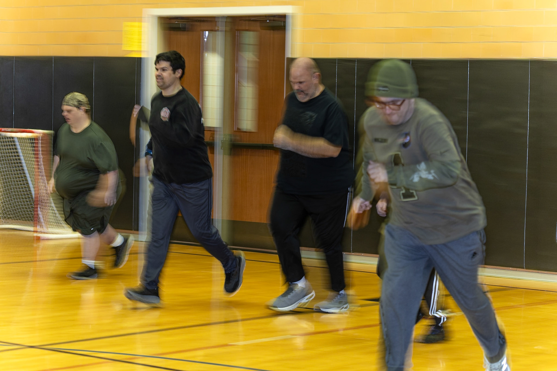 Floorball warmup for Dan Entress and his teammates includes running back and forth in the Churchville Elementary School gym, in Churchville, NY on Dec, 9, 2025.