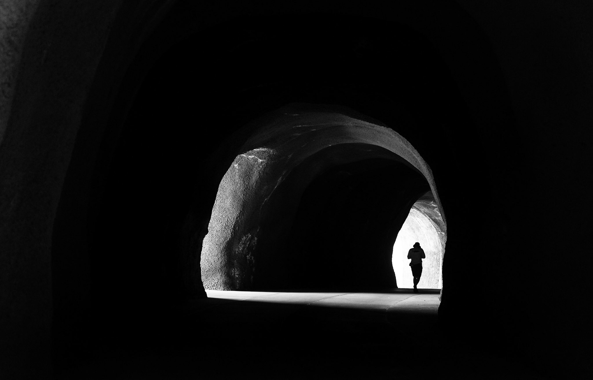 Nash Newton hikes the newly opened, pedestrian-only tunnel at Mitchell Point near Hood River, Oregon on May 30, 2025. The $31 million, 655-foot underground passageway is part of a larger project to create a 73-mile bikeway in the Columbia River Gorge.